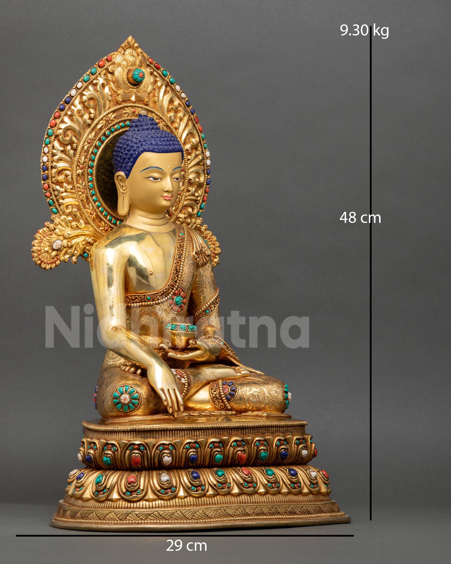 Side view of Buddha Shakyamuni sculpture seated on a double lotus throne with detailed halo and sacred meditation symbolism.