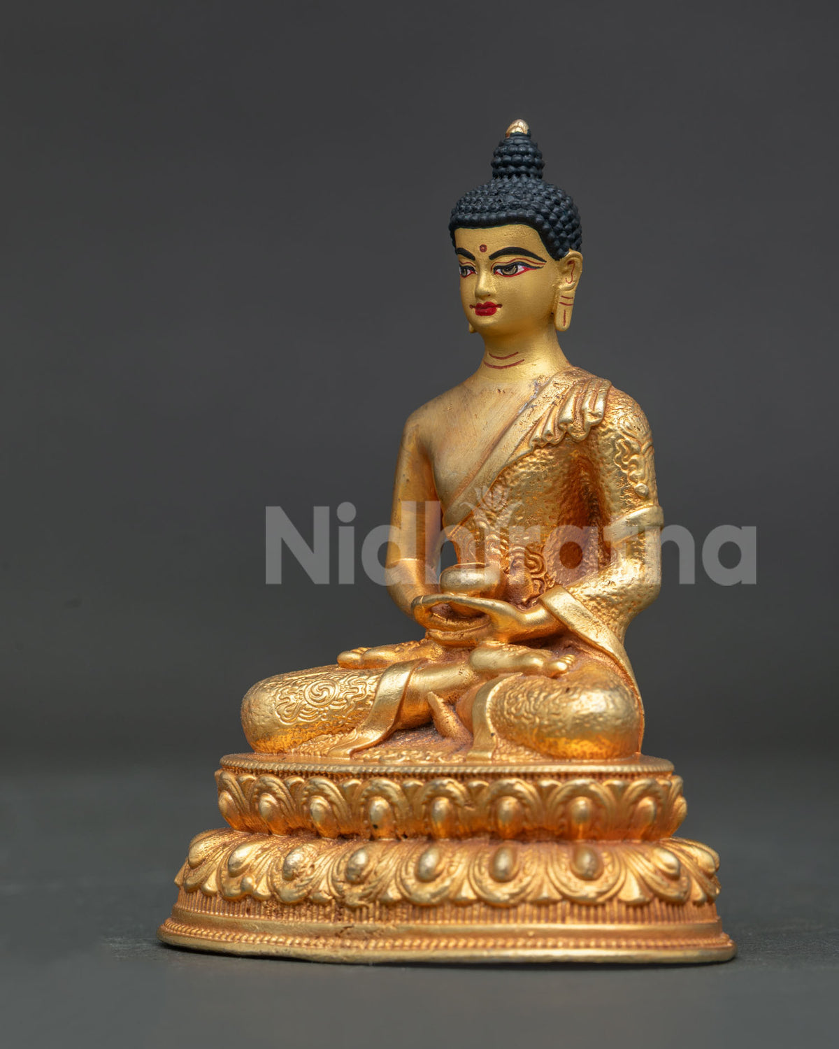 Side View of copper Amitabha Buddha statue seated on handcarved double lotus pedestal with alms bowl.