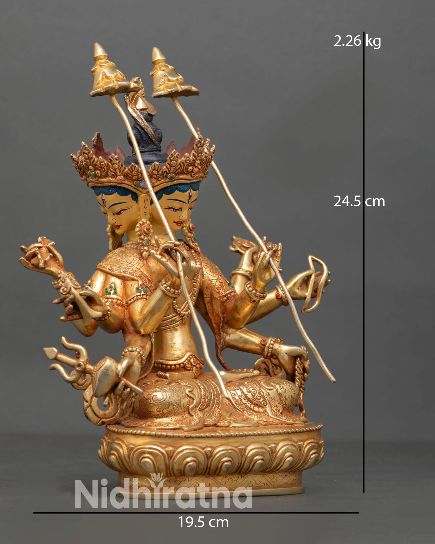 Side view of Dhoja Devi statue, holding sacred attributes including umbrella symbols with gold gilded copper detailing and spiritual protection symbolism