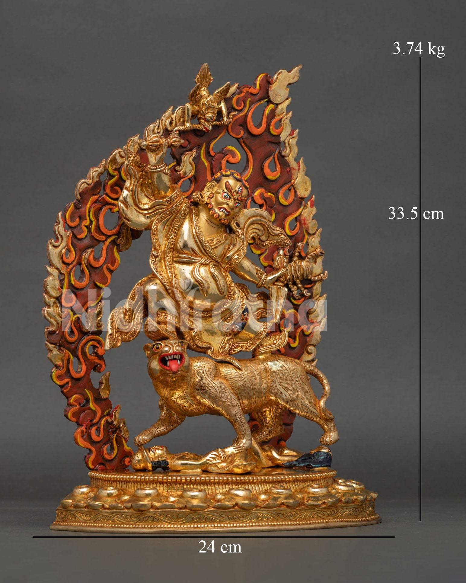 Side view of Dorje Drolo Vajrayana Buddhist sculpture showcasing intricate flame details, mythical creatures, lotus base, and traditional Himalayan craftsmanship.