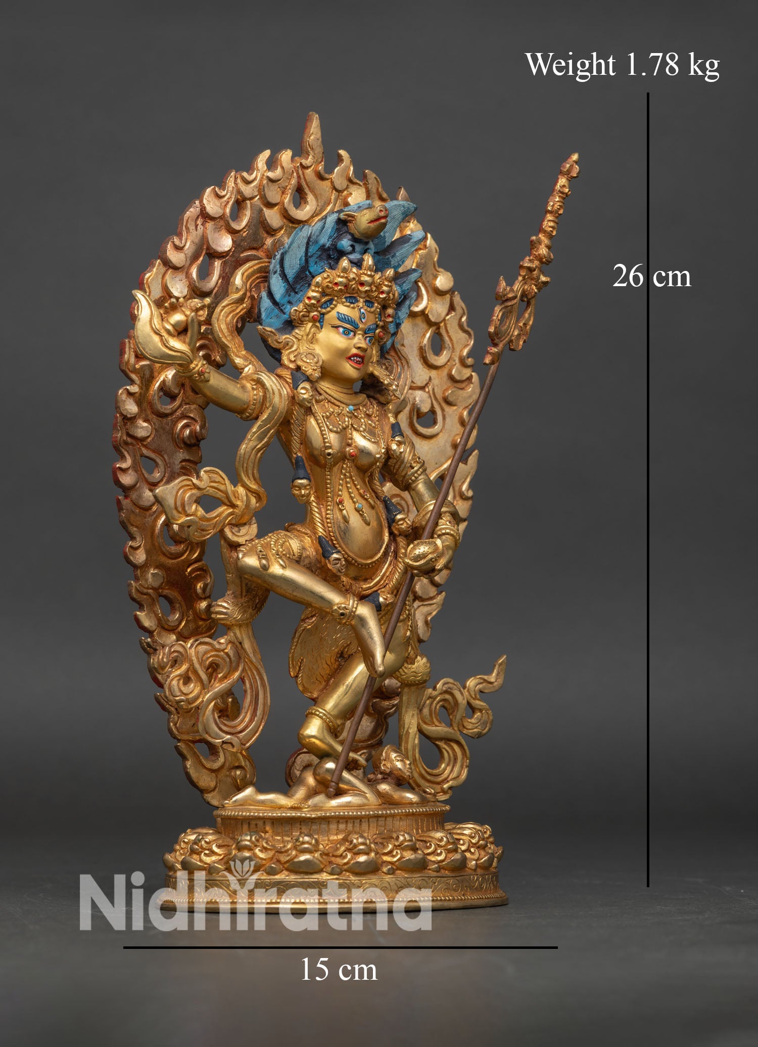 side view of Dorje Phagmo statue standing posture adorned with semi-precious stones hand-painted colors Nepalese artisan