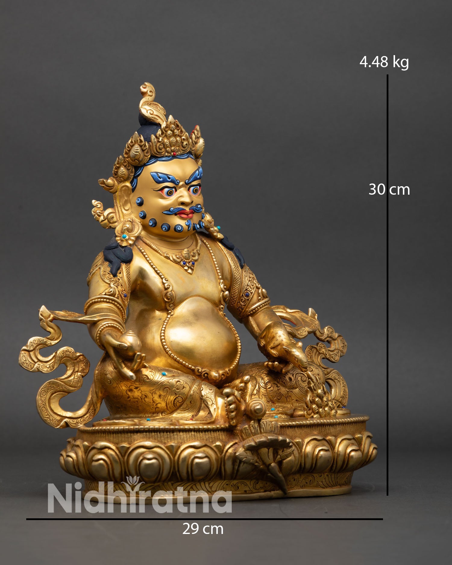 Side view of Dzambhala statue hand-engraved lotus seat and robes