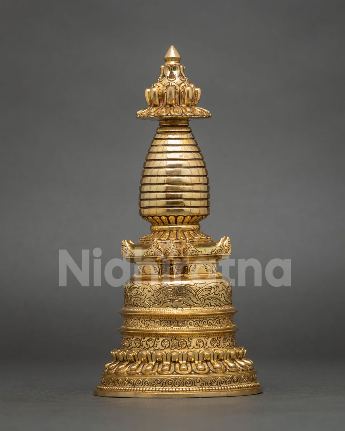 Side view of gold-plated copper Kadampa Stupa featuring traditional Newari craftsmanship