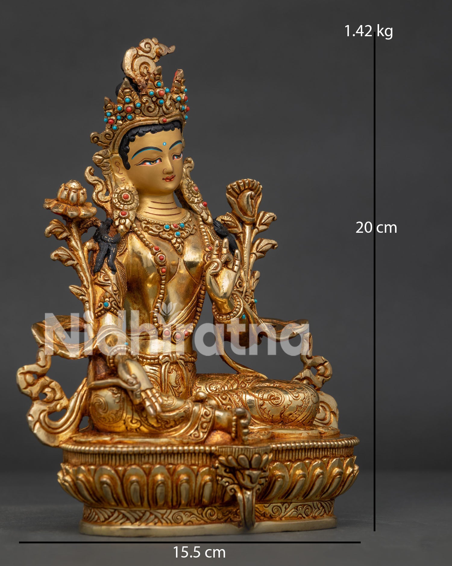 Side view of Green Tara sculpture, showing Varada Mudra Abhaya Mudra and lotus flower details