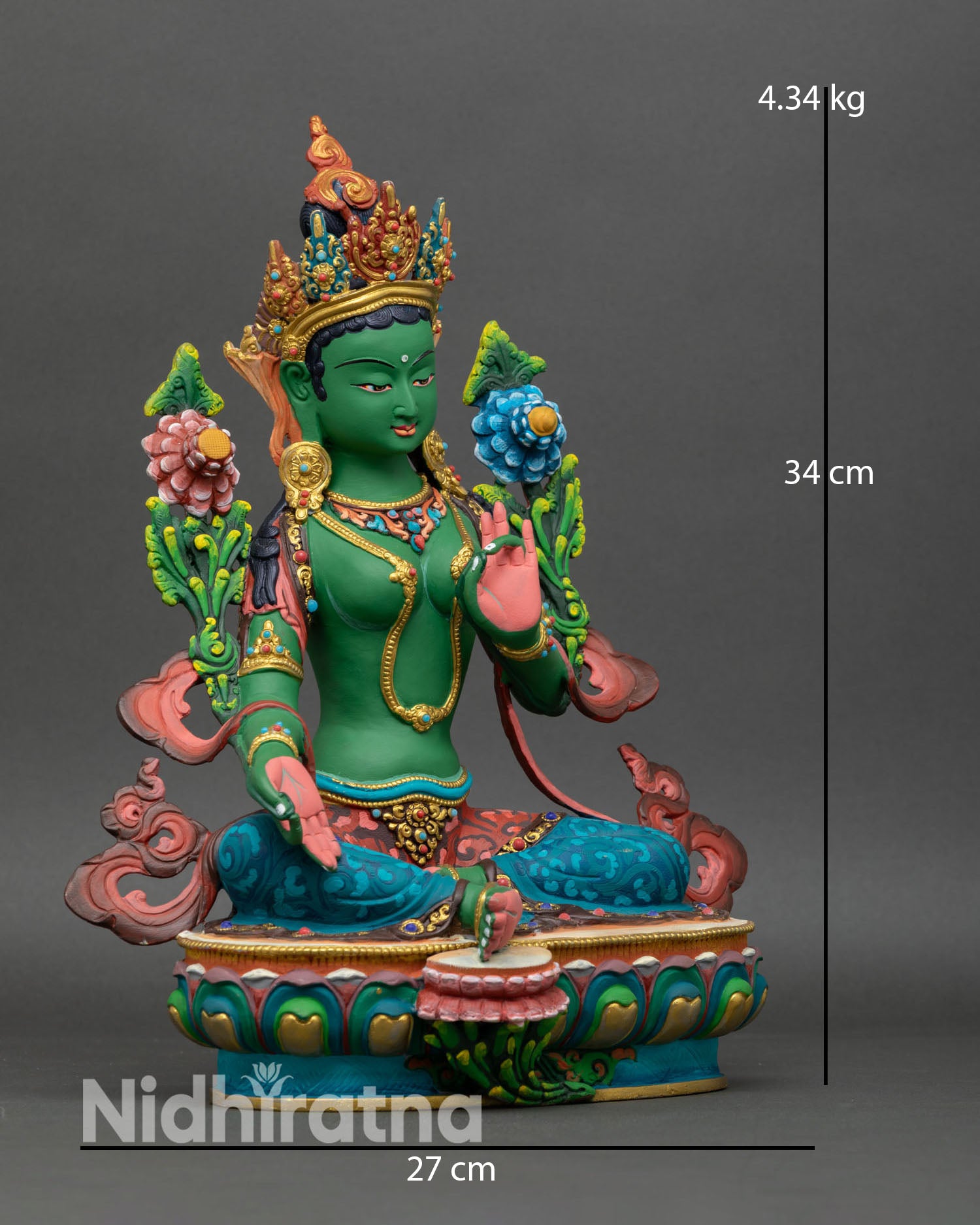 Side view of Green Tara statue seated on lotus seat with varada mudra and blue utpala lotus symbolizing compassion and enlightenment