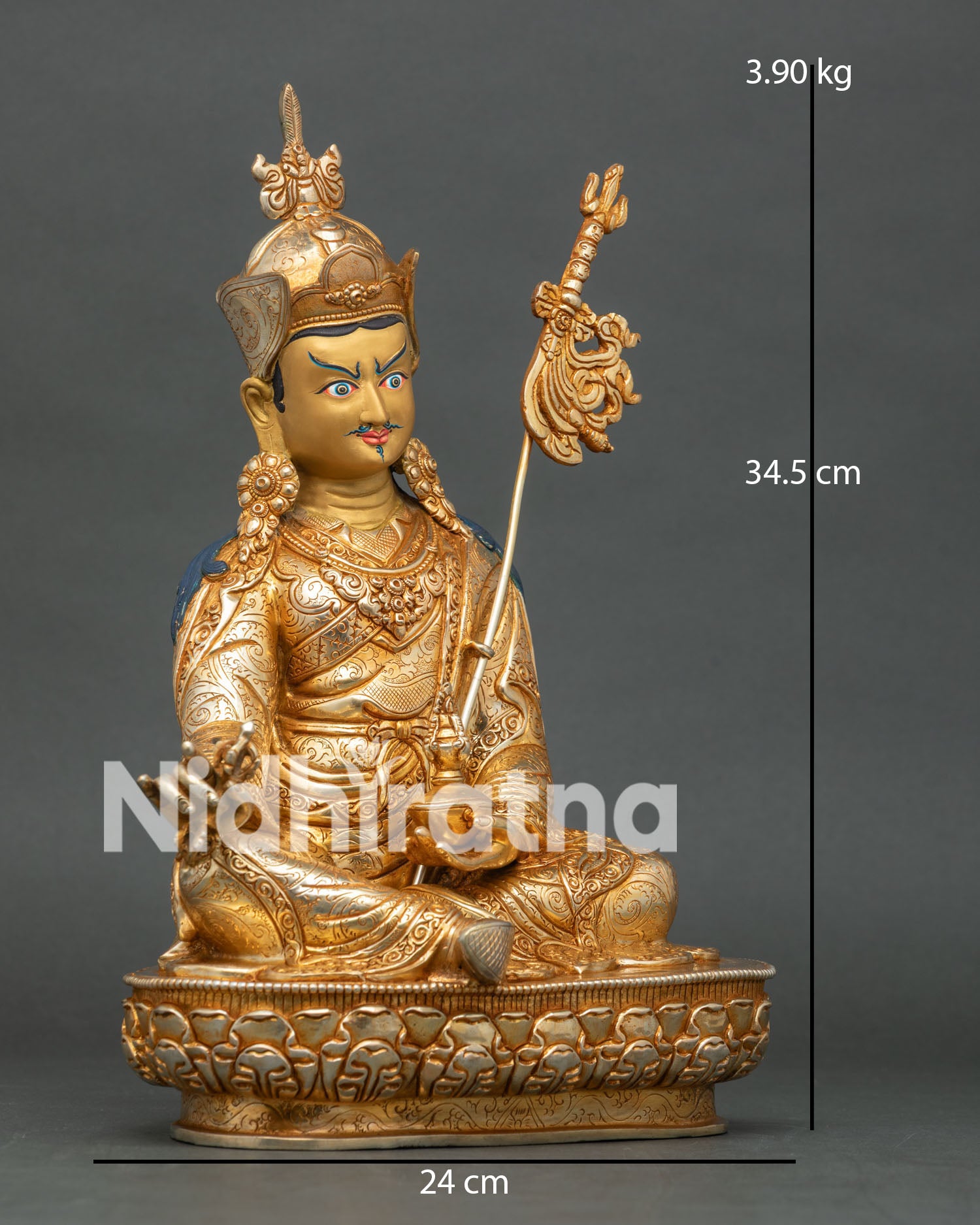 Side view of Guru Rinpoche seated on lotus pedestal holding vajra skull cup and khatvanga staff