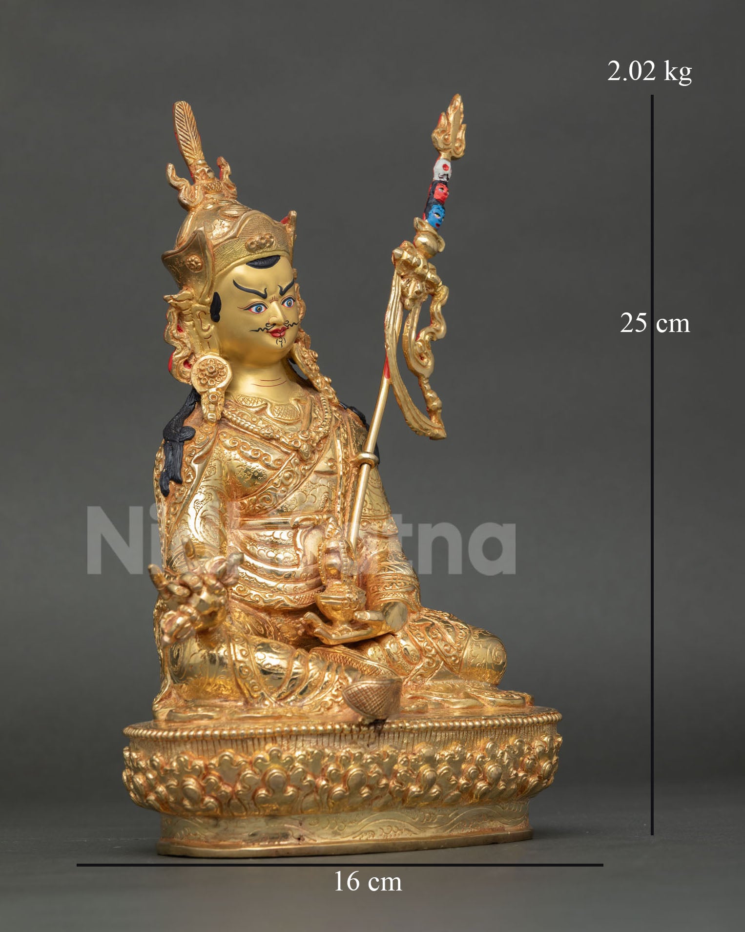Side view of Guru Rinpoche statue highlighting vajra, kalash, and trident with refined lost-wax casting craftsmanship from Nepal.