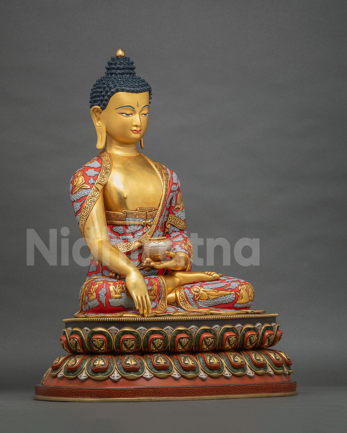 Side view of handcrafted Shakyamuni Buddha statue holding a patra bowl on a double-lotus pedestal