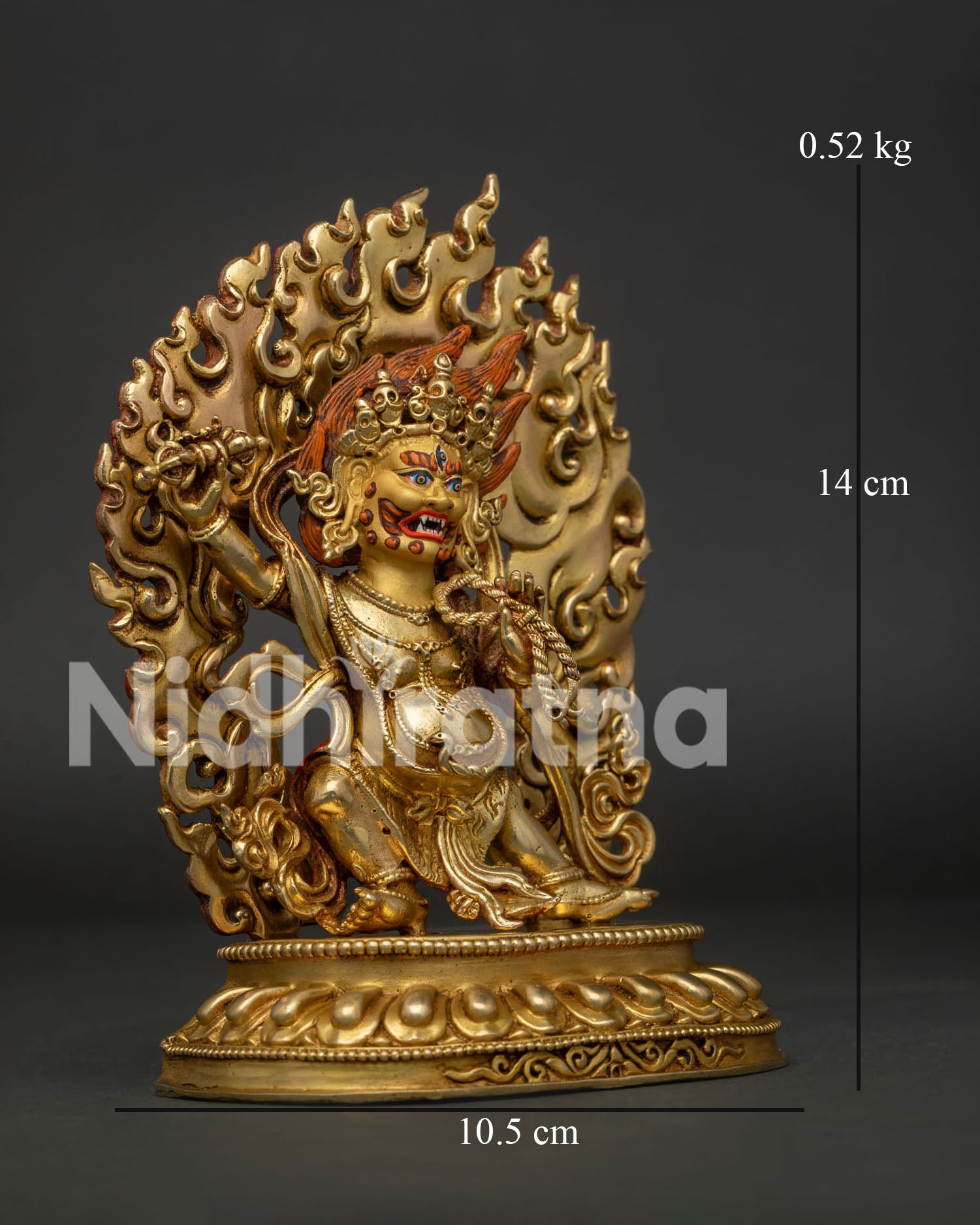 Side view of handcrafted Vajrapani sculpture standing, Surrounded by blazing flames