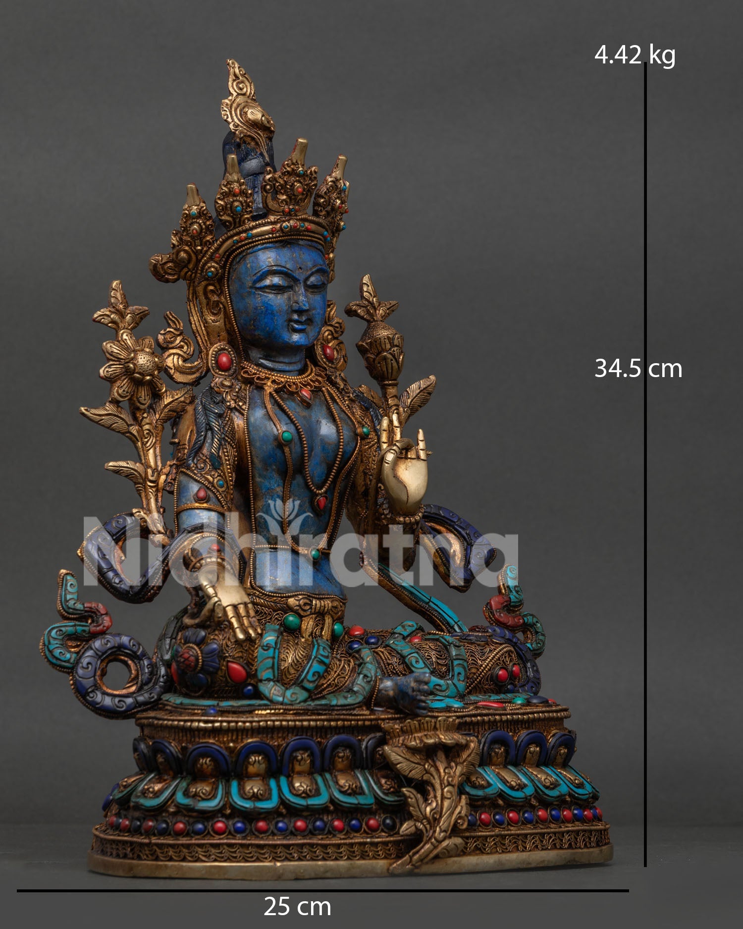 Side view of Himalayan Green Tara statue on double lotus pedestal with extended right leg
