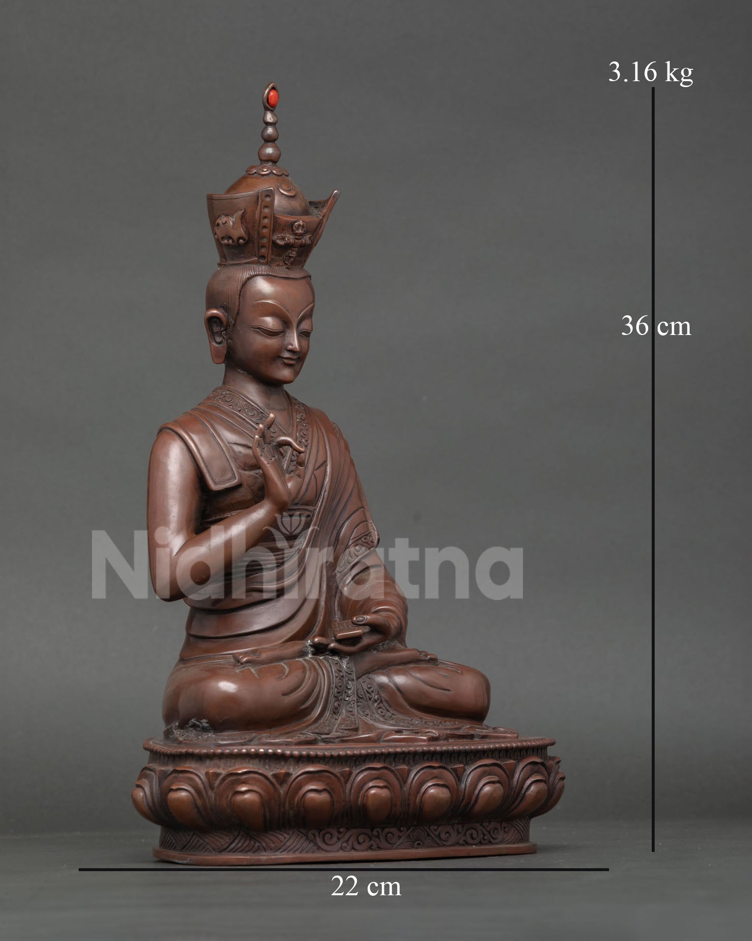 Side view of His Holiness the 16th Karmapa statue in teaching posture with detailed monastic robes and decorative scrollwork