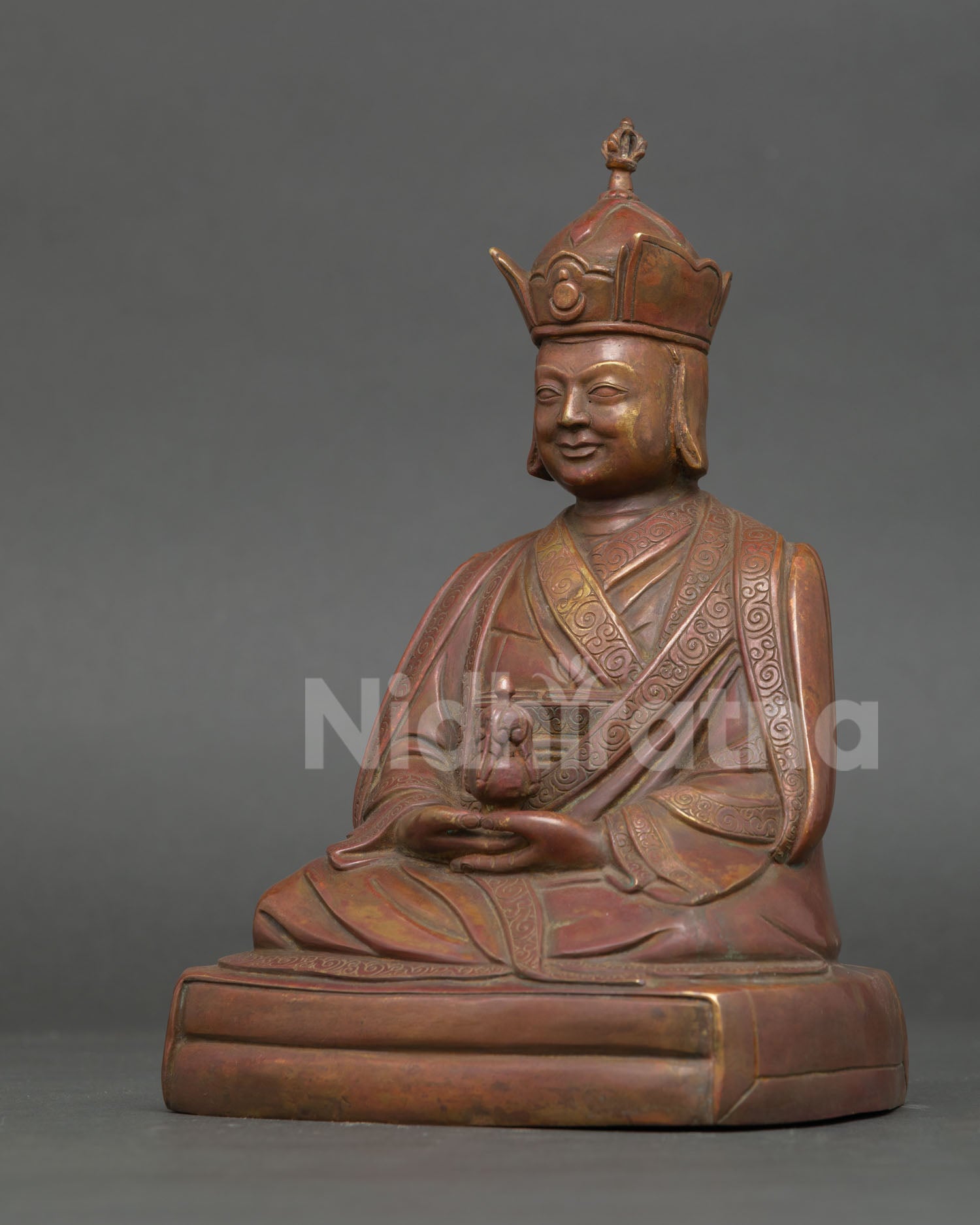 Side View of Karmapa Statue with Traditional Buddhist Robe and Pedestal Details