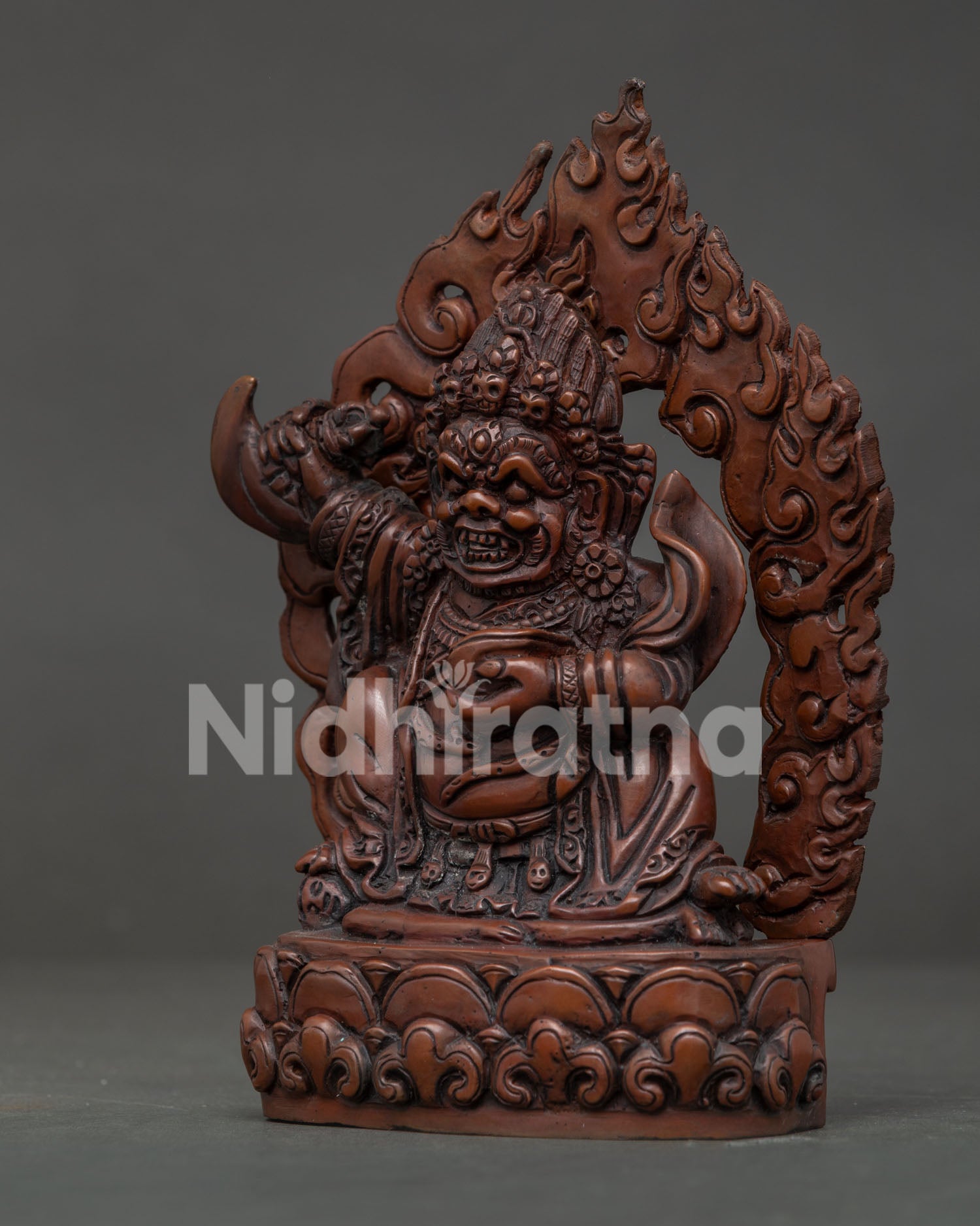 Side View of Mahakala Bernagchen Statue Standing on Lotus Pedestal with Flames.