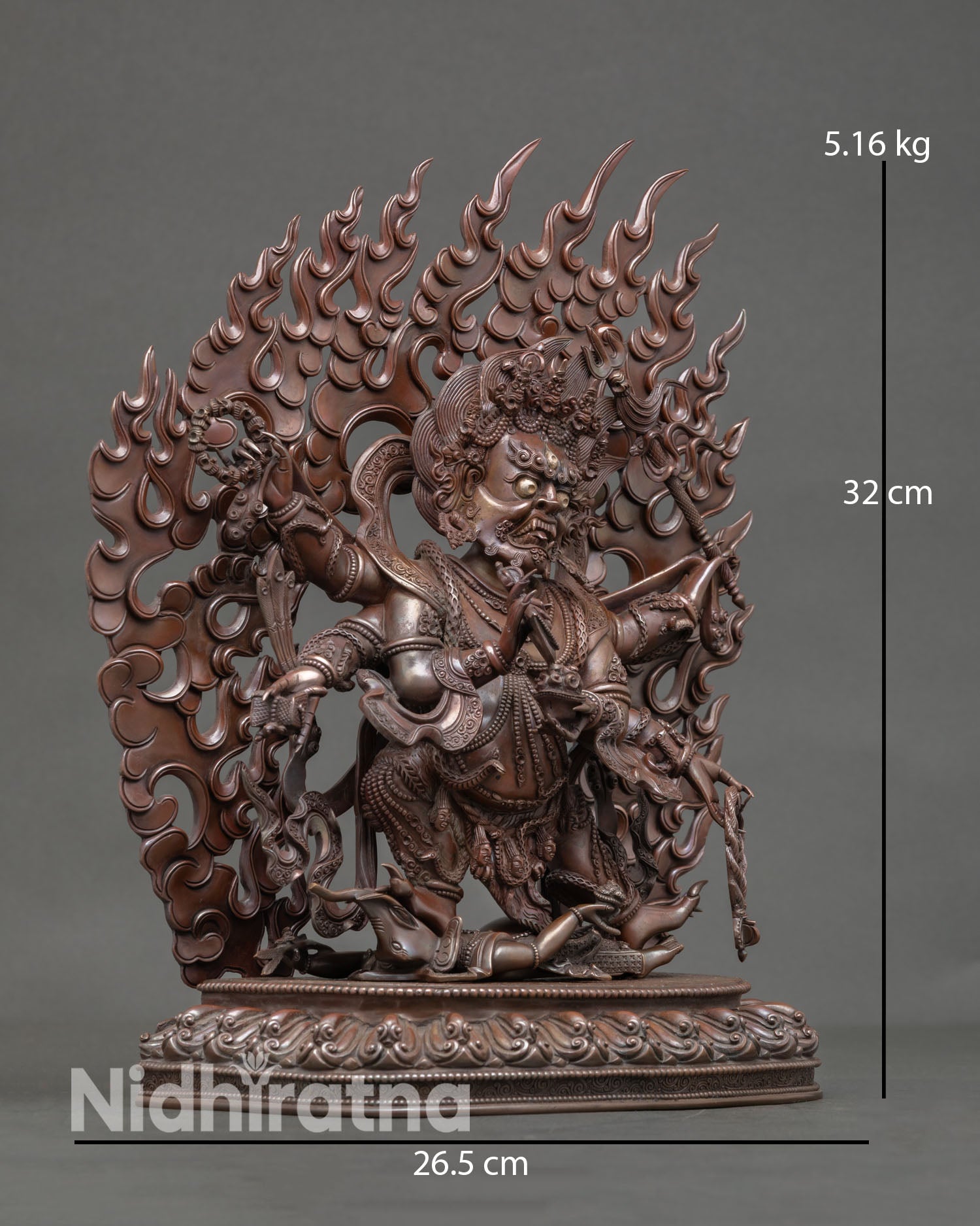 Side view of Mahakala statue showing six arms holding damaru trident lasso skull cup and rosary, handcrafted copper Vajrayana protector sculpture for sacred rituals