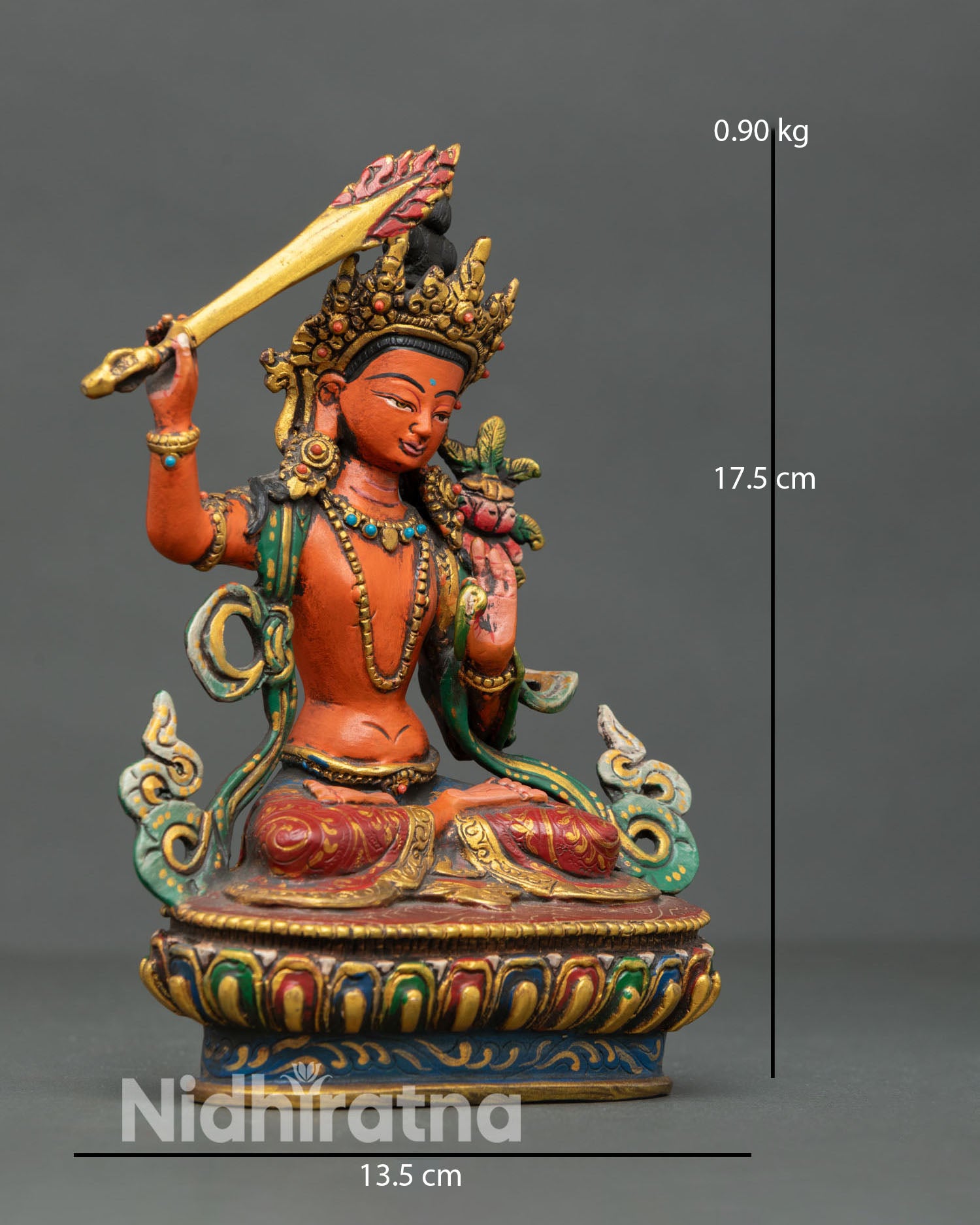 Side view of Manjushri Bodhisattva statue highlighting flowing multicolored robes lotus base intricate metalwork and flaming sword of wisdom