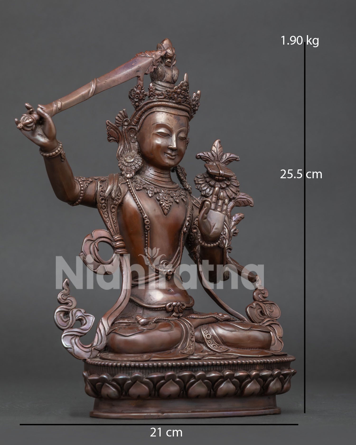 Side view of Manjushri Buddhist sculpture holding the flaming wisdom sword