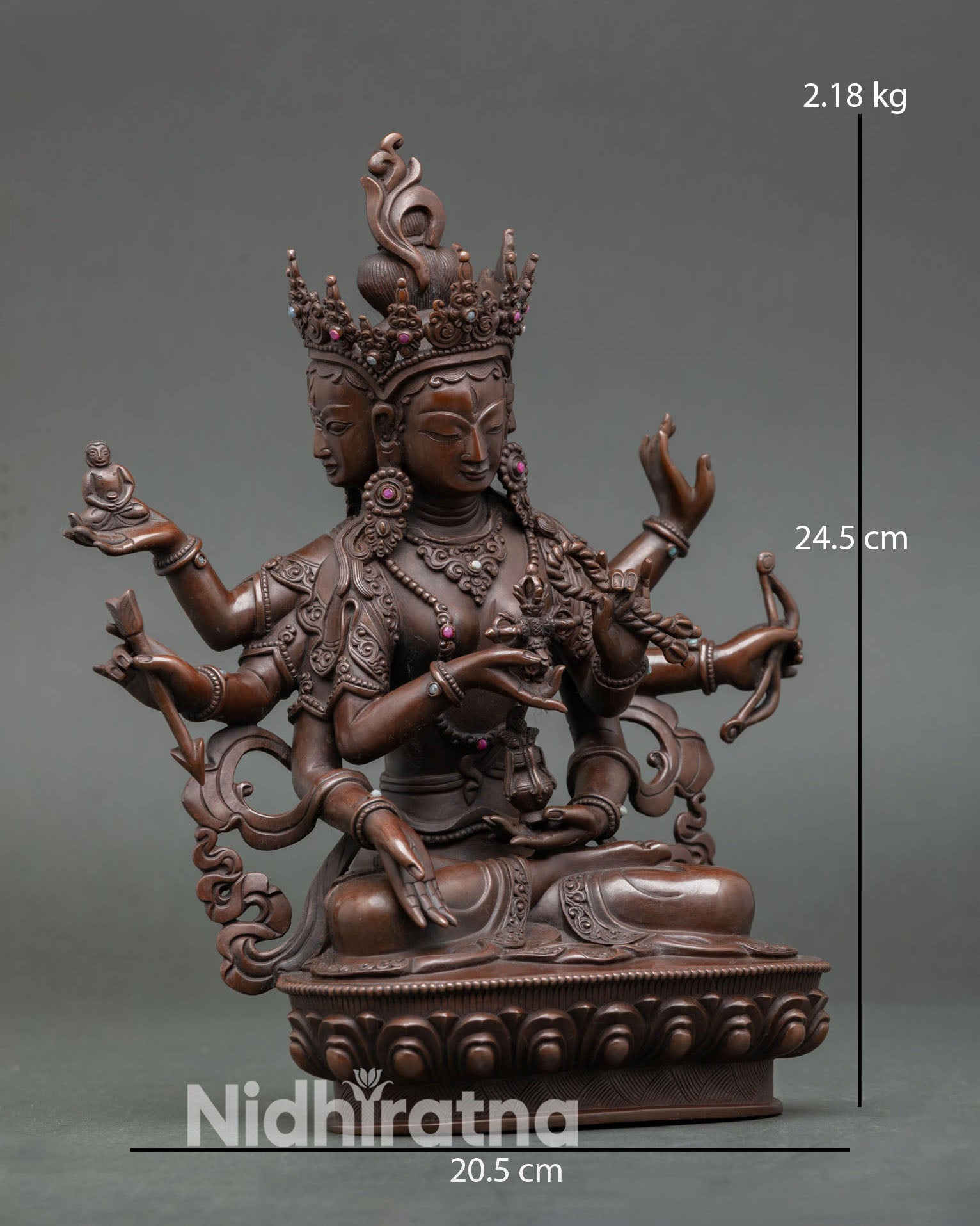 Side view of Namgyalma statue seated on lotus base traditional Newari craftsmanship Buddhist altar sculpture