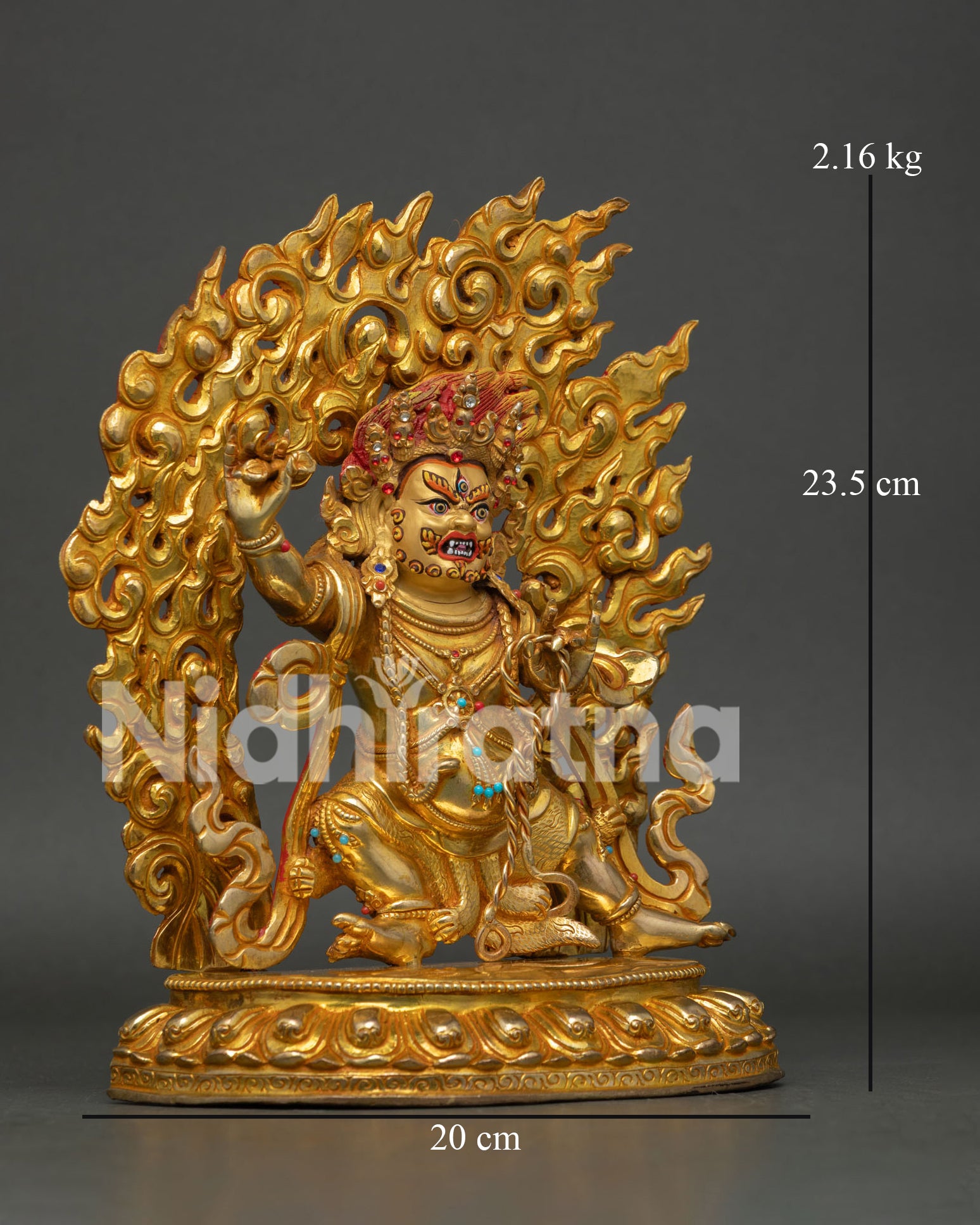 Side view of Vajrapani Buddhist protector statue, holding vajra and lasso on lotus pedestal