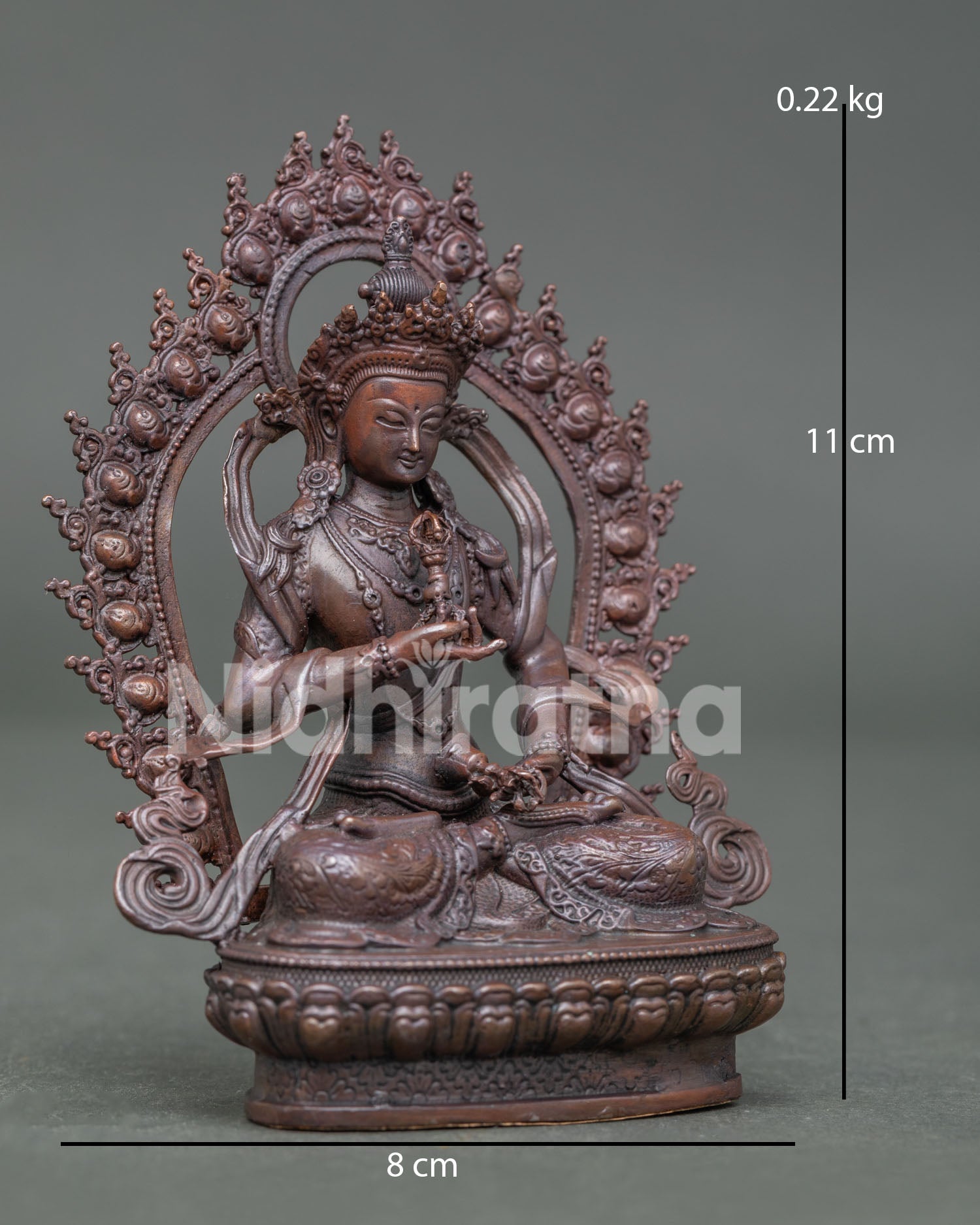 Side view of Vajrasattva Buddha Statue holding vajra and bell with ornate halo