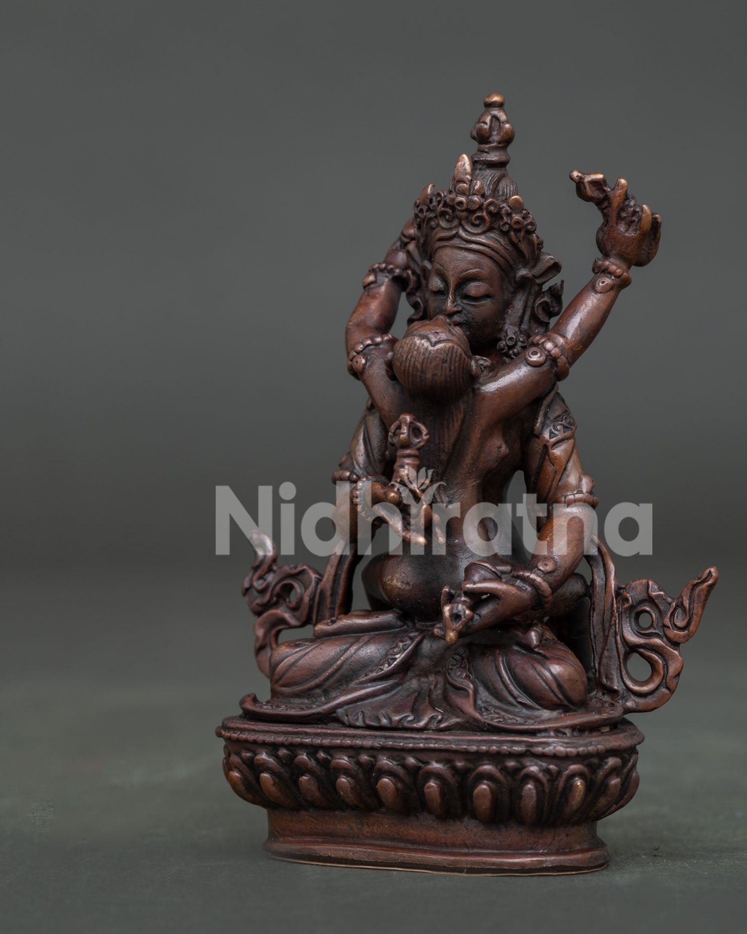 Side view of Vajrasattva yab yum statue with intricate Nepalese craftsmanship.