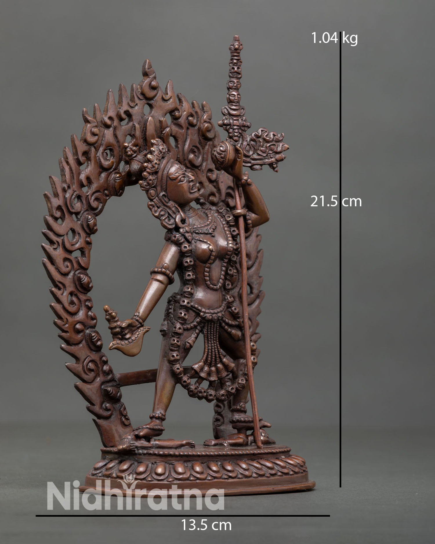 Side view of Vajrayogini statue with trident in oxidized copper, Vajrayana altar decor.