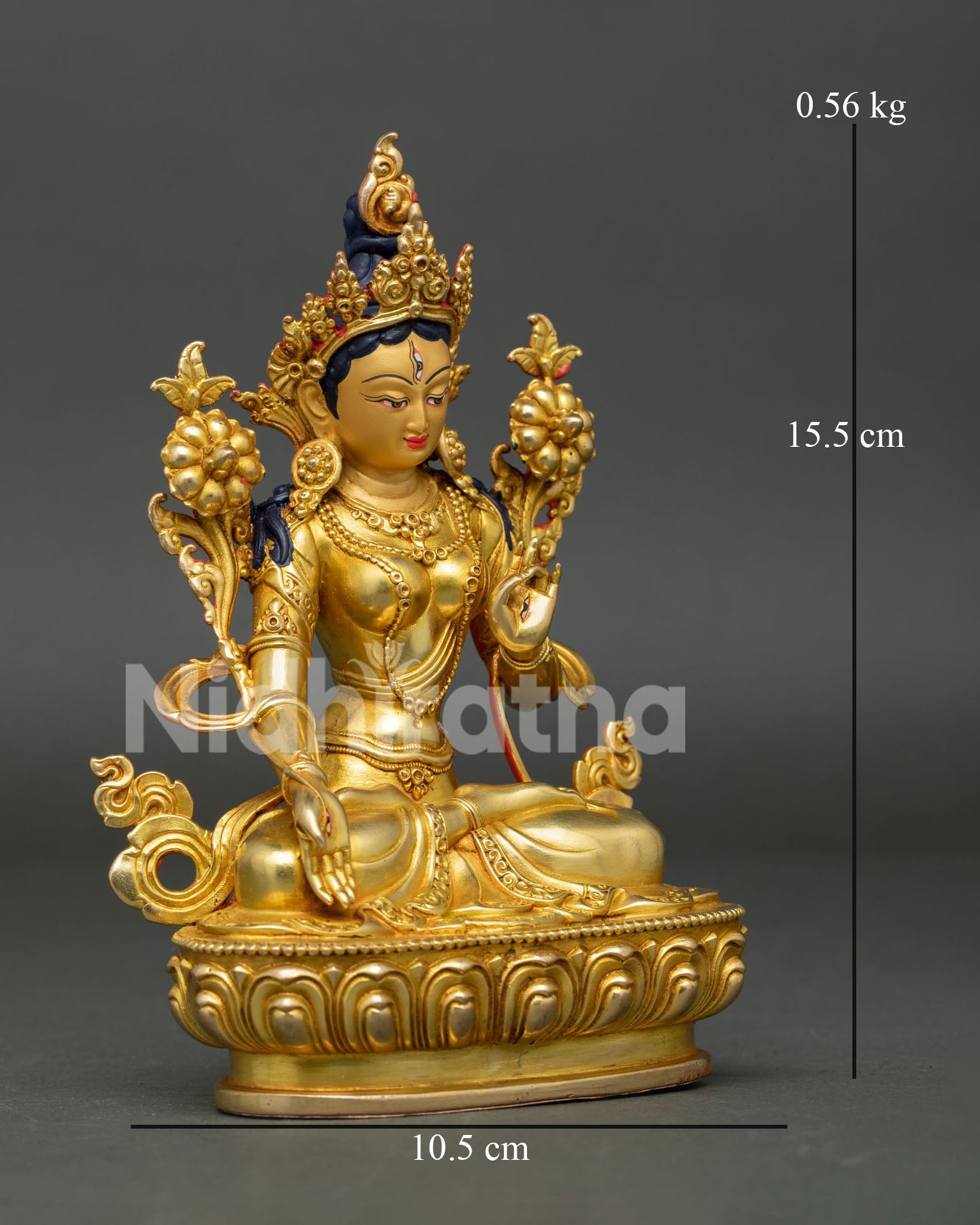 Side view of White Tara sculpture featuring copper body, lotus throne, and traditional Himalayan craftsmanship