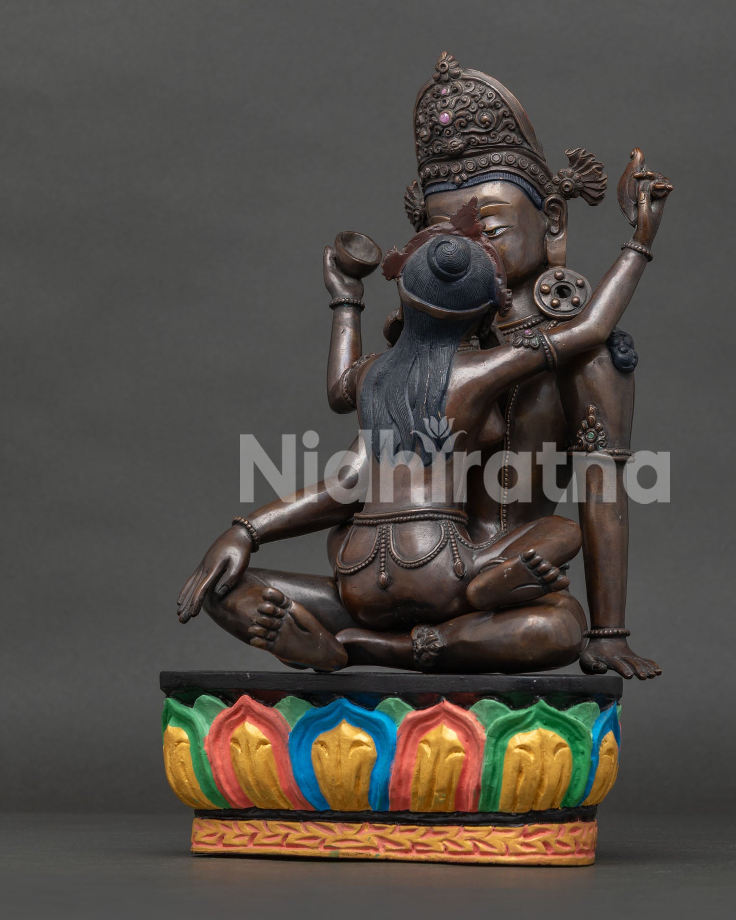 Side view of oxidized copper Indra with consort Nepalese Buddhist statue.
