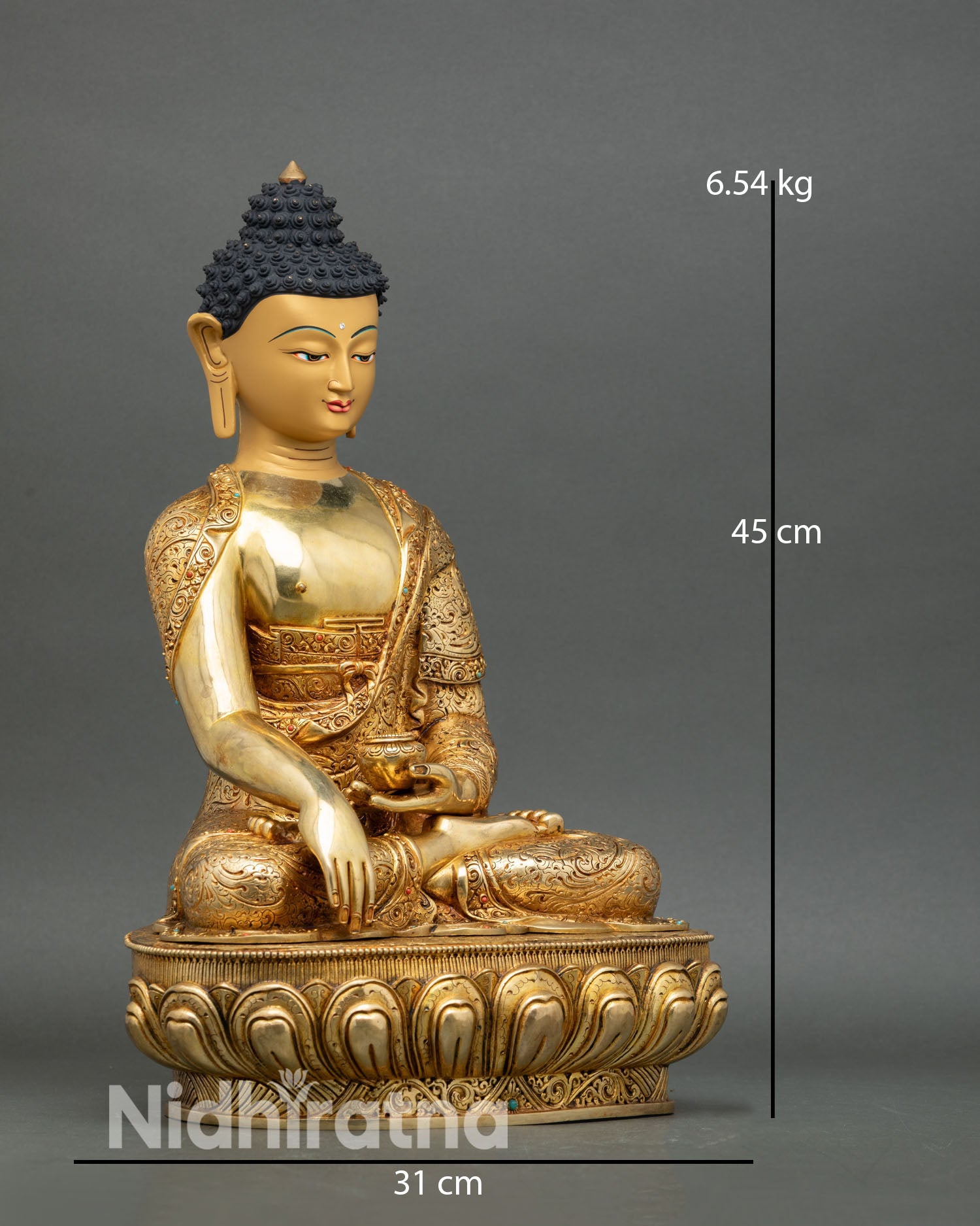 Side view of Shakyamuni Buddha statue with floral robe carving gold gilded copper