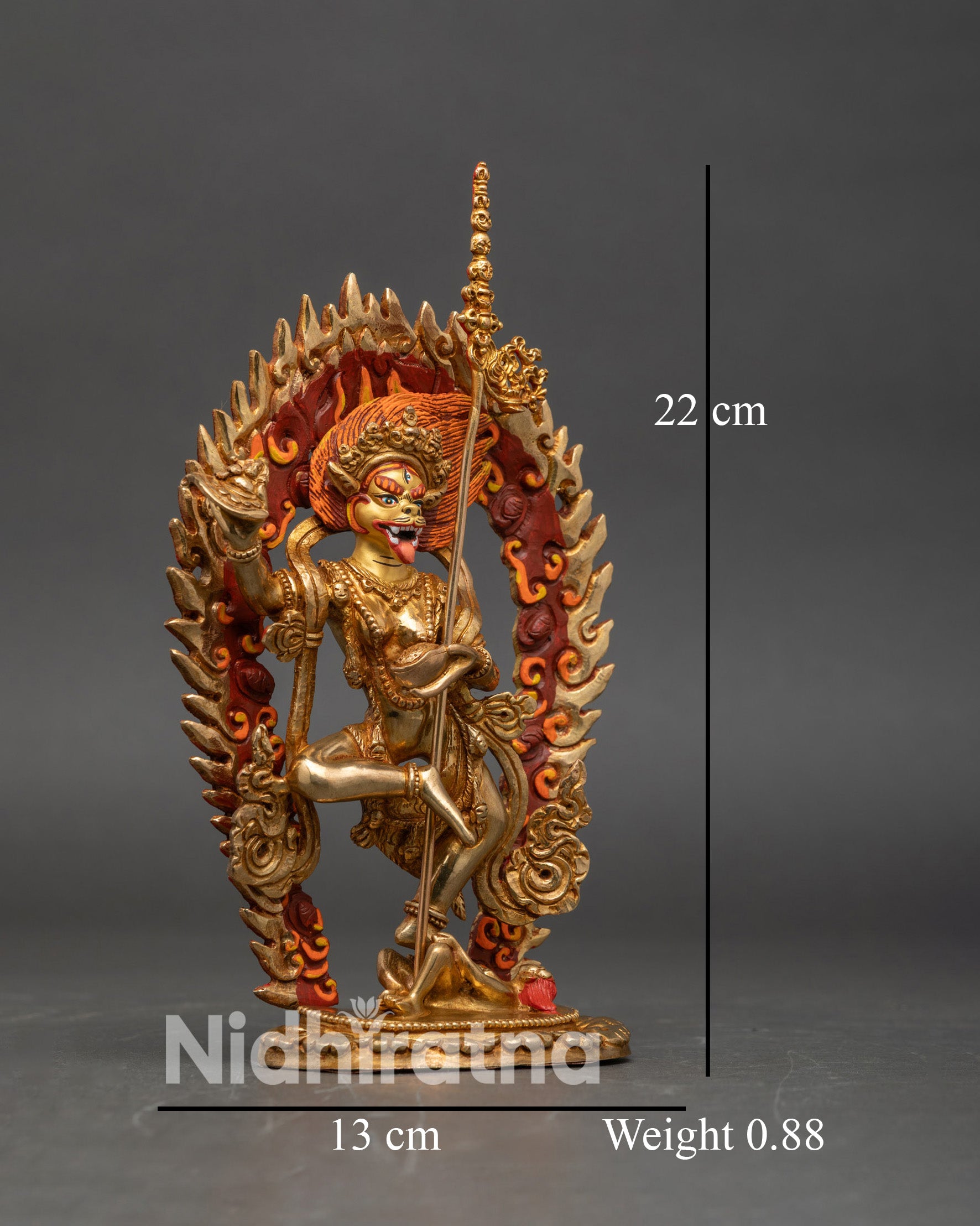 Side view Simha Mukha statue holding kartika knife skull cup khatvanga trident sacred deity