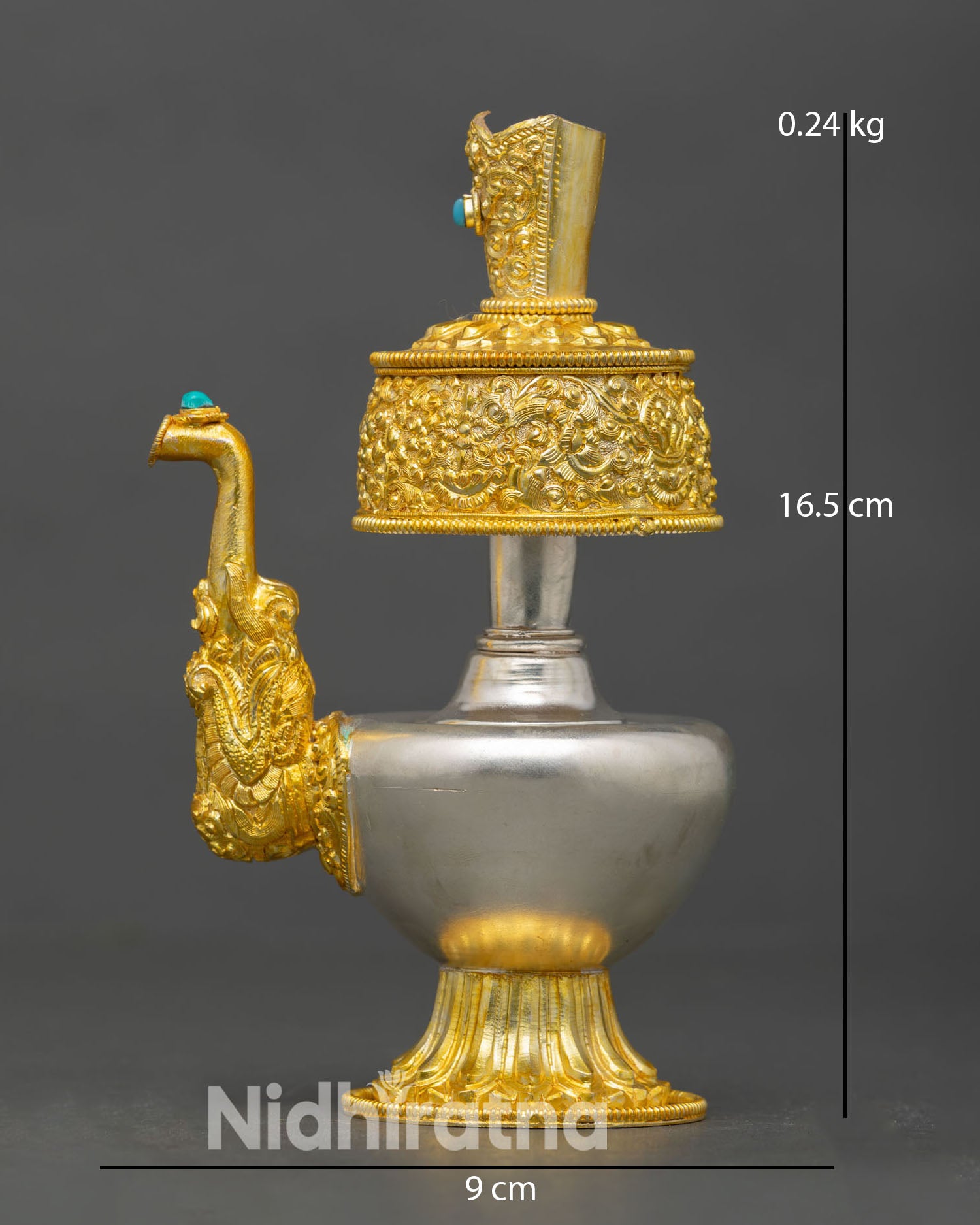 Side view Tibetan Bhumba ritual vessel curved body pouring spout gold plated base floral carvings Nepal Buddhist altar water offering pot