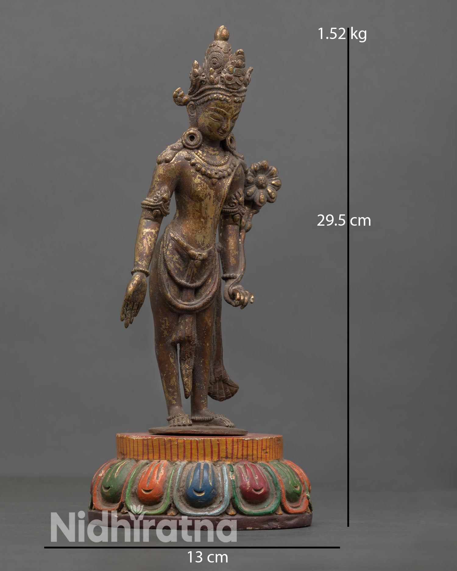 Side view of two armed Lokeshvara statue varada mudra lotus flower stem holding hand Himalayan Buddhist meditation art antique finish sculpture