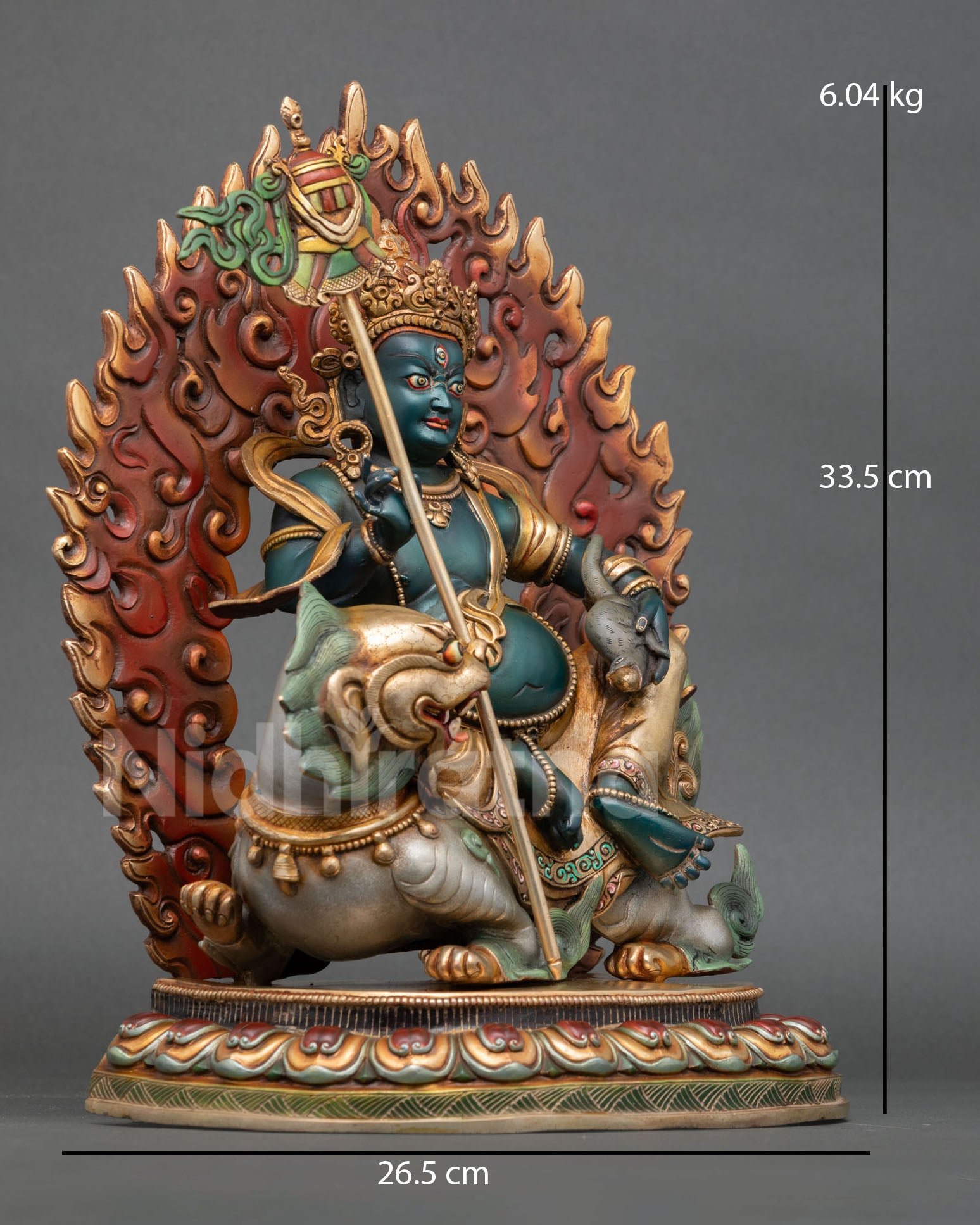 Side view of Vaisravana Namtoshe wealth deity statue with victory banner and jewel spilling mongoose symbolism