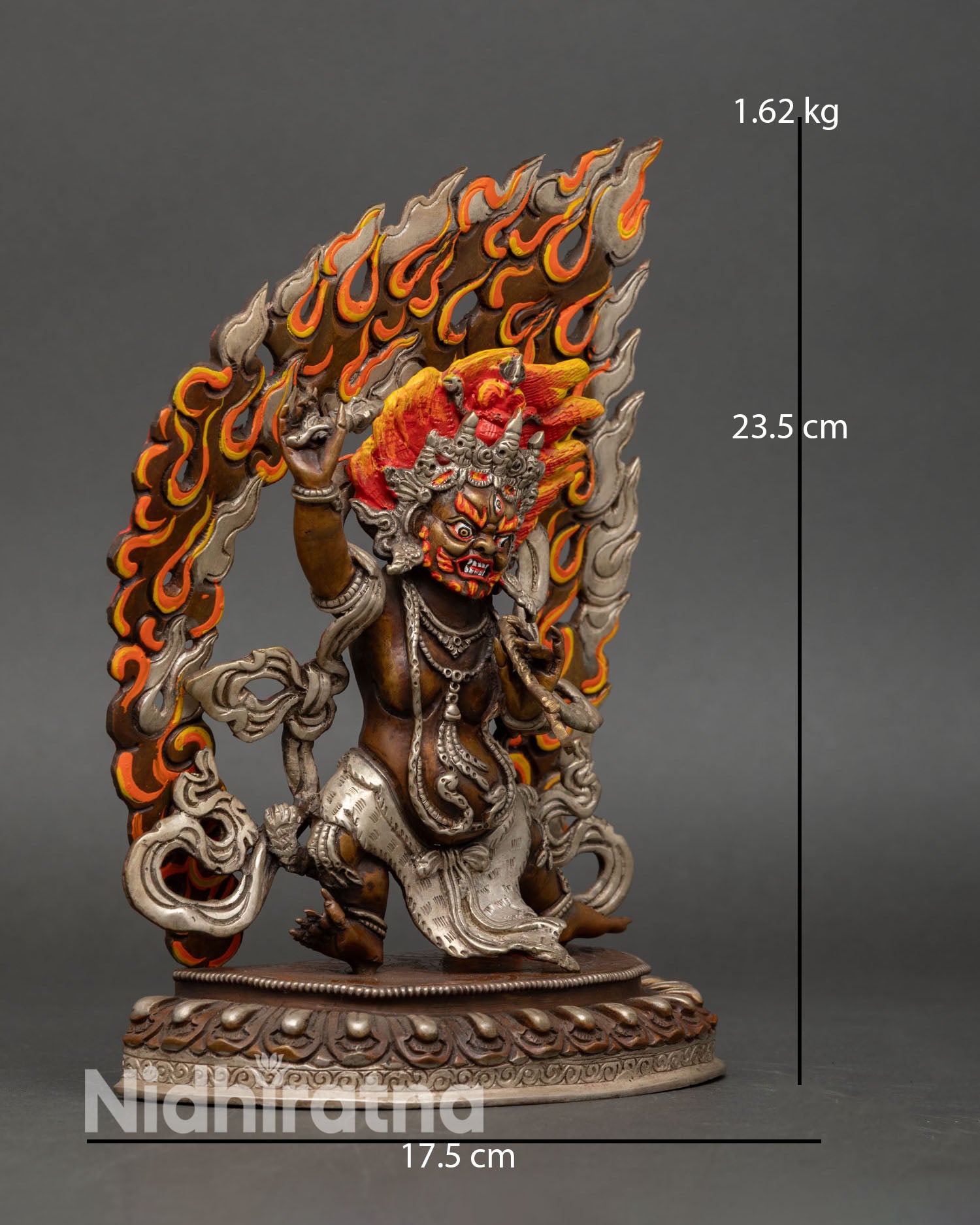 Side view of Vajrapani statue, oxidized copper Tibetan protector deity energy force destroy ignorance sacred Buddhist sculptur