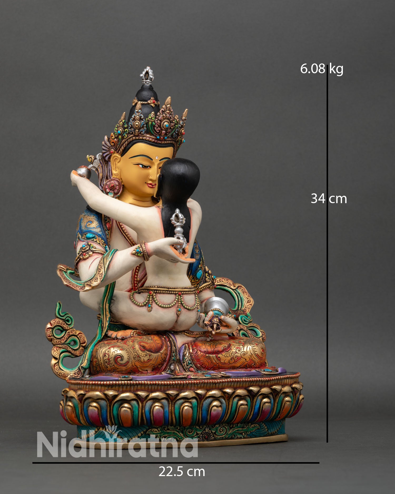Side view of Vajrasattva and consort statue seated lotus seat Yab Yum posture hand painted acrylic colors sacred Buddhist deity sculpture
