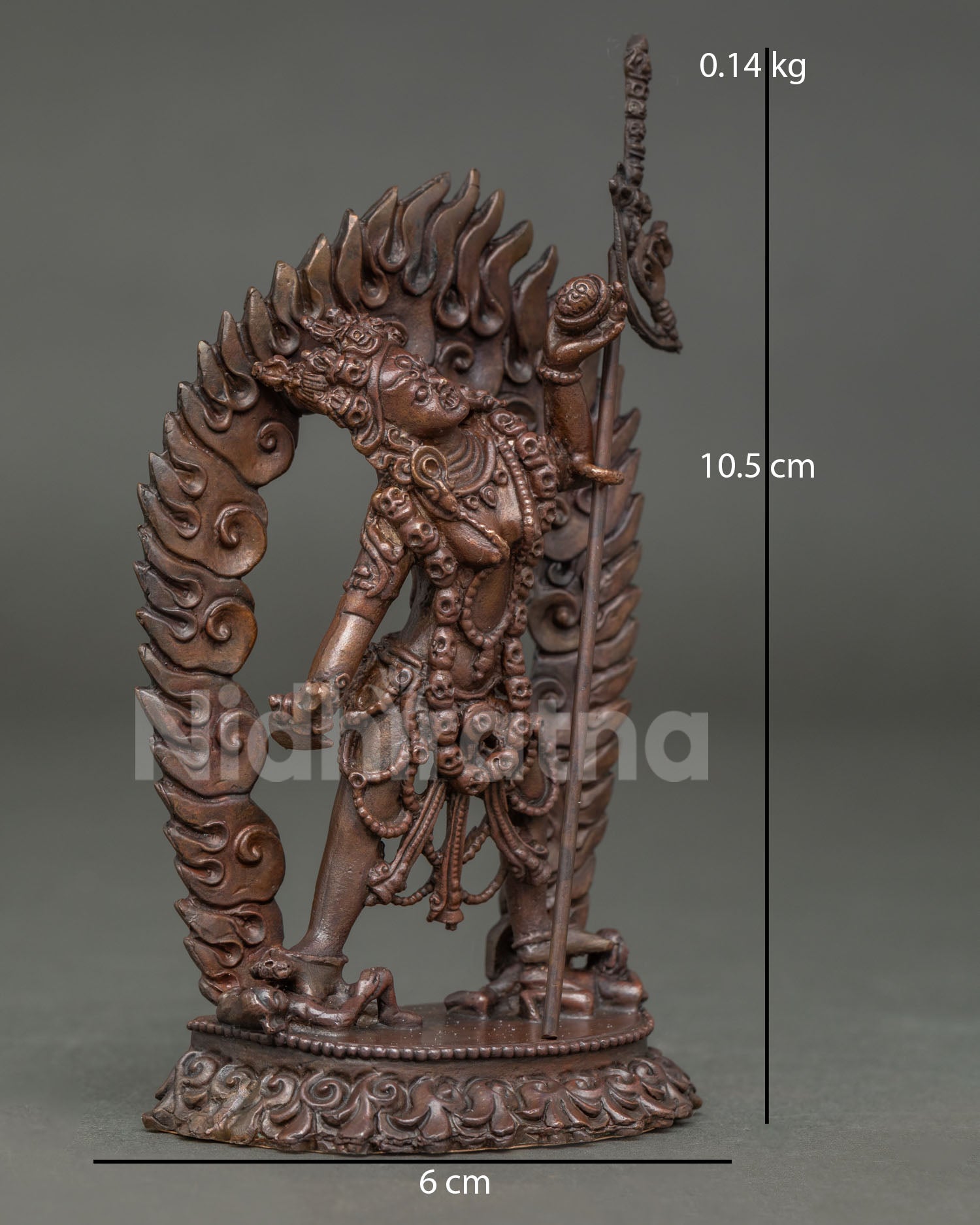 Side view of Vajrayogini statue in dynamic posture holding trident symbolizing transformation and spiritual awakening