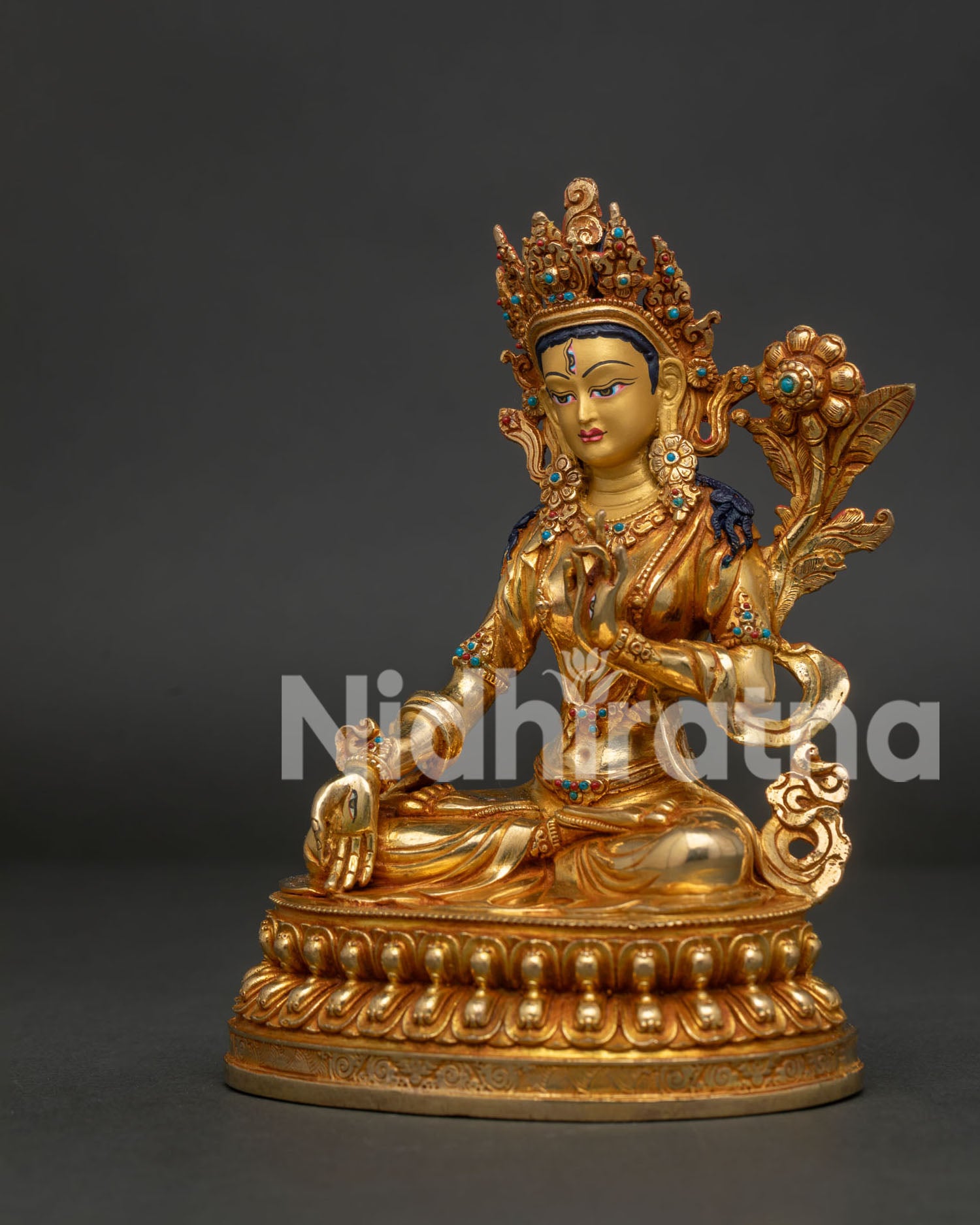 Side View White Tara Statue Showing Compassionate Gesture and Semi Precious Stones.