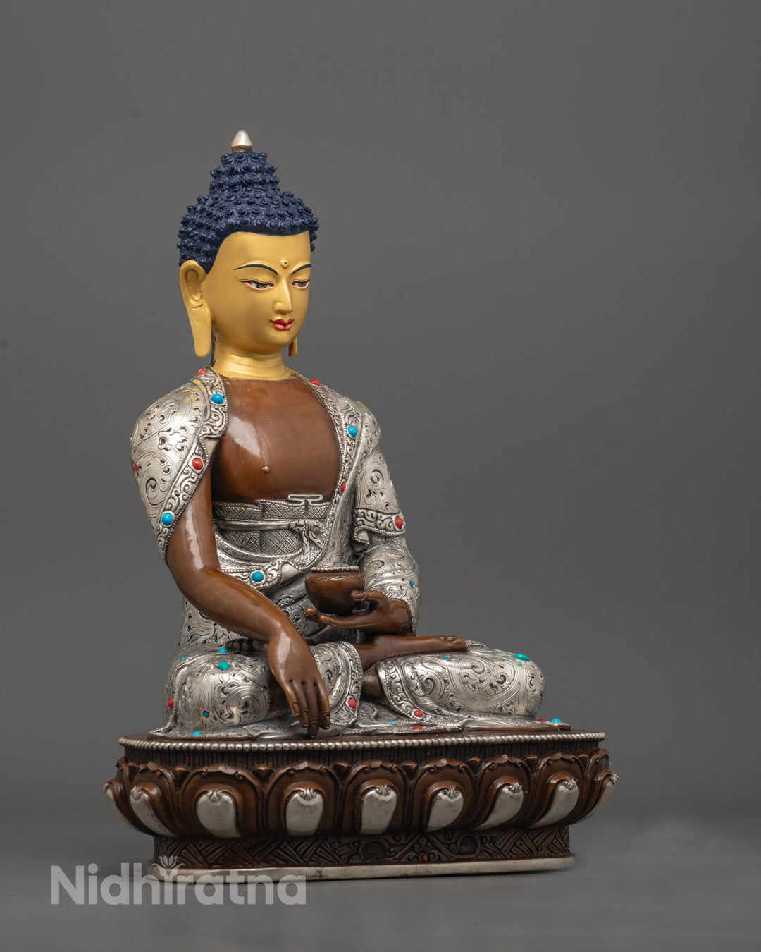 side angle of Oxidized Shakyamuni Buddha showing bhumisparsha mudra and detailed carvings