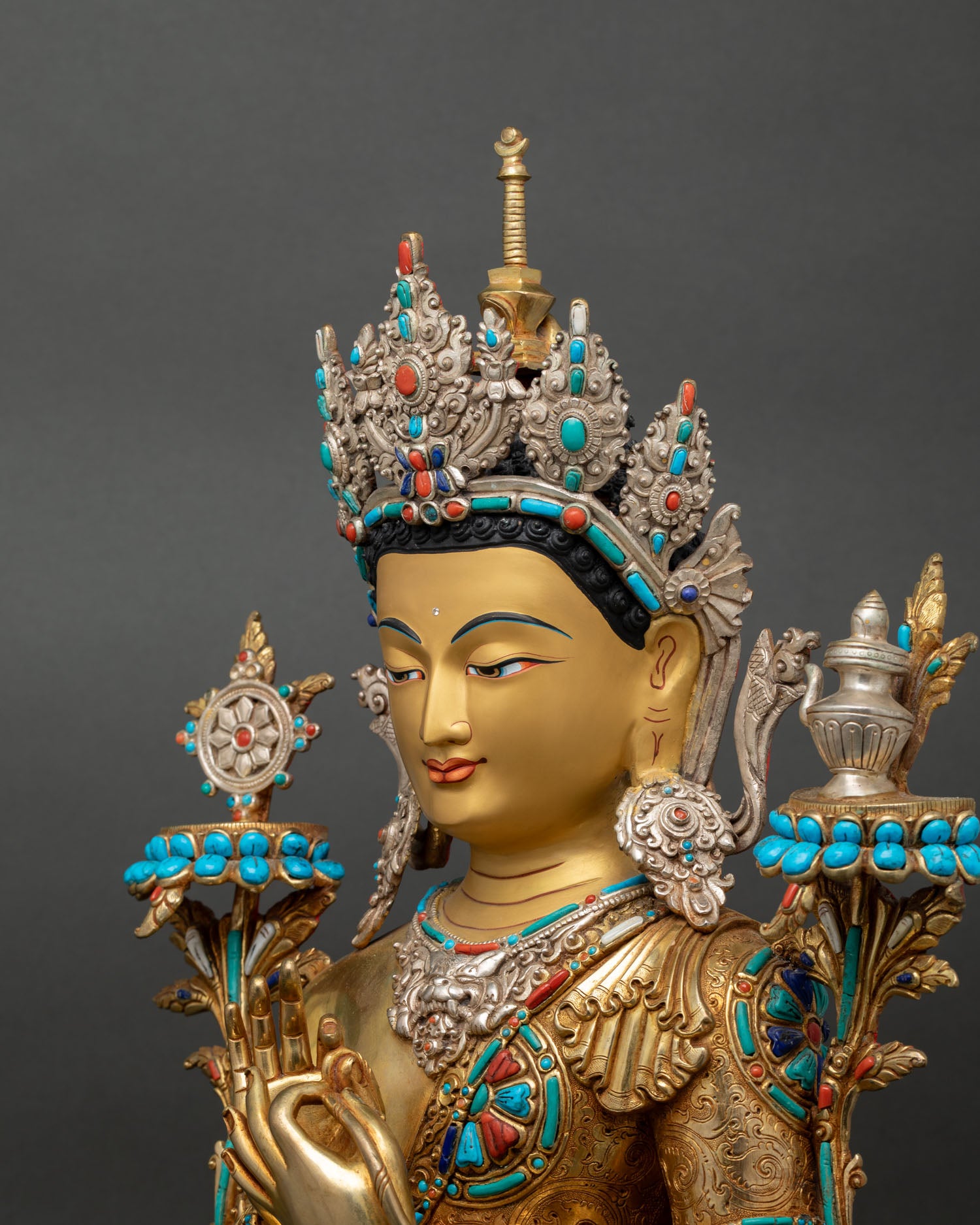 Side close up Maitreya Buddha Statue, fine repoussé metalwork, copper details and gold ornaments
