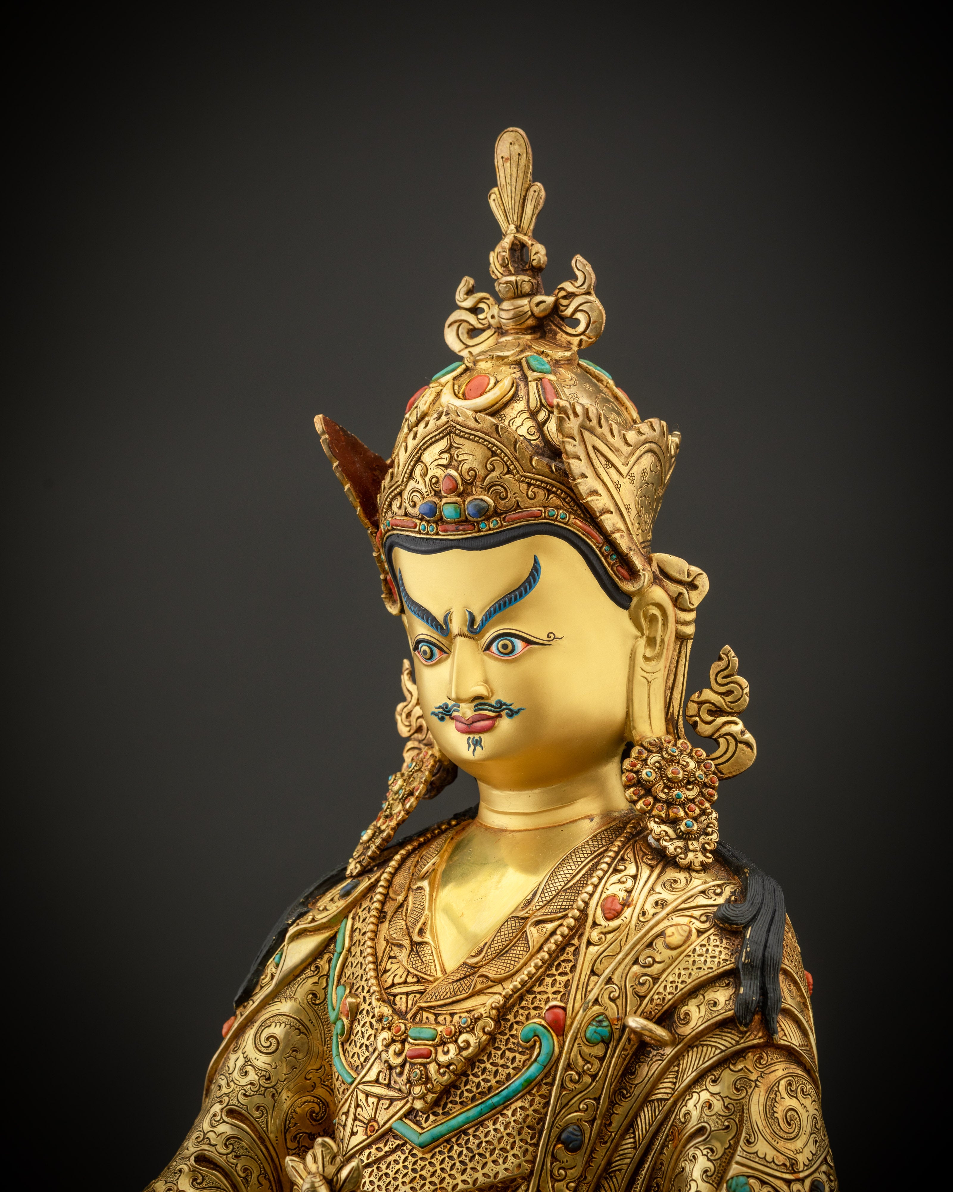 side close up face Guru Rinpoche 24K gold gilded Padmasambhava statue handmade Nepal