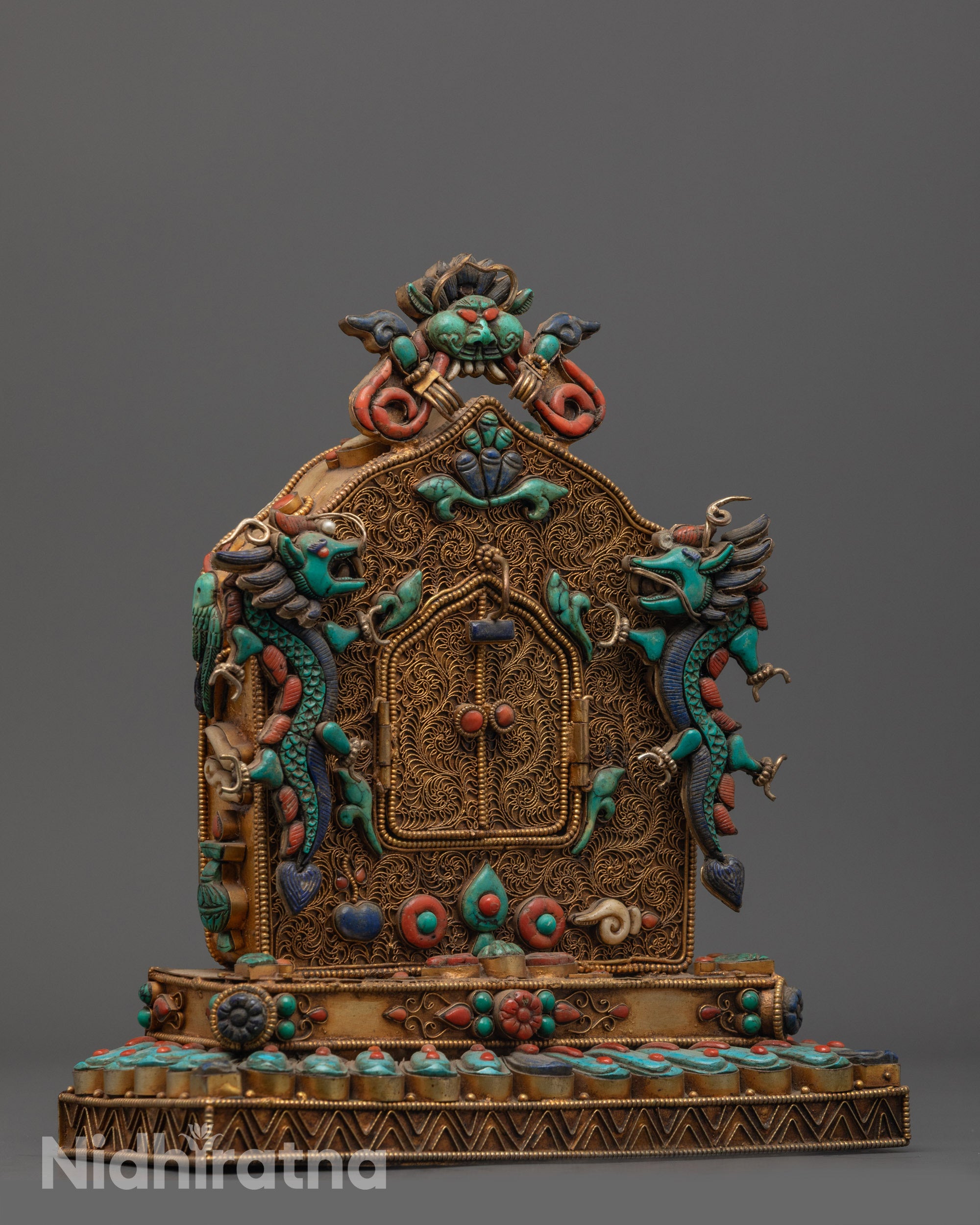 side view Buddha Shakyamuni Ghau Box with intricate copper filigree and auspicious motifs