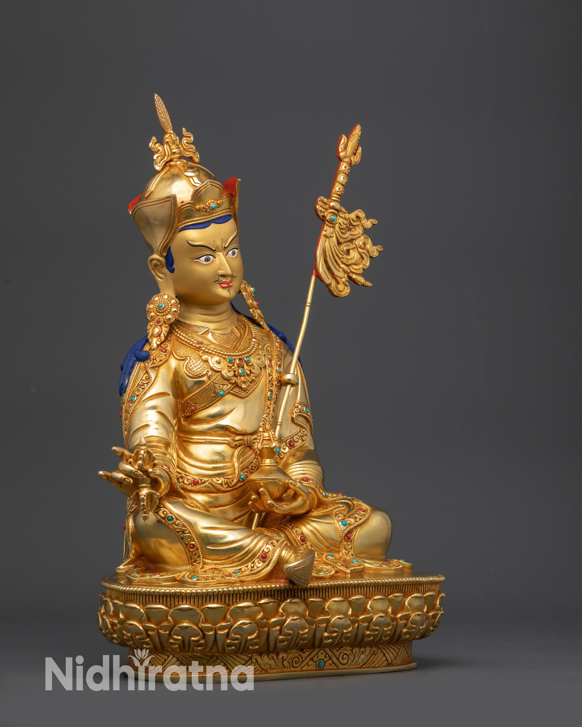 side view Guru Padmasambhava statue with kasaya robe and lotus seat