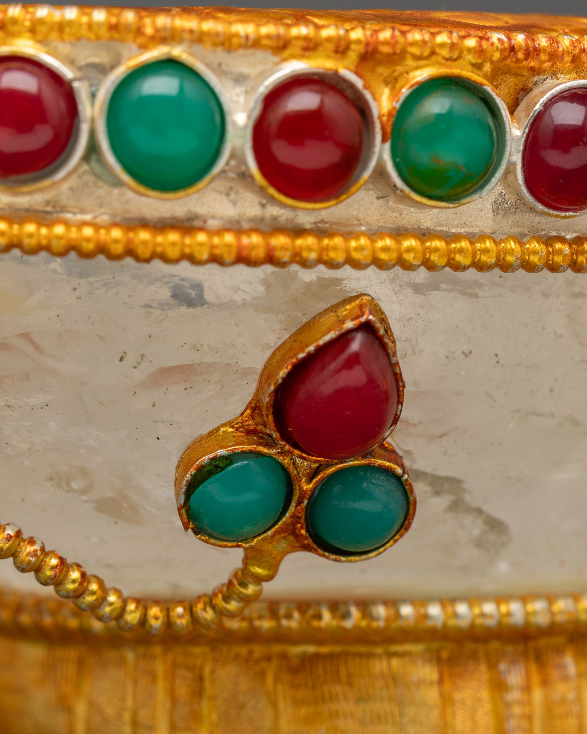 side view Tibetan Kapala bowl with intricate gold design and crystal base