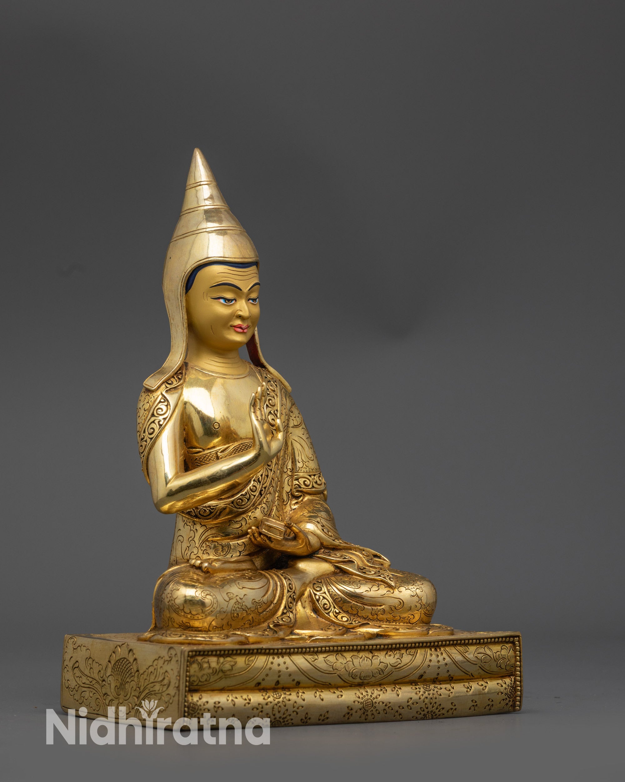side view Tibetan monk Santaraksita sculpture showing intricate robe motif patterns