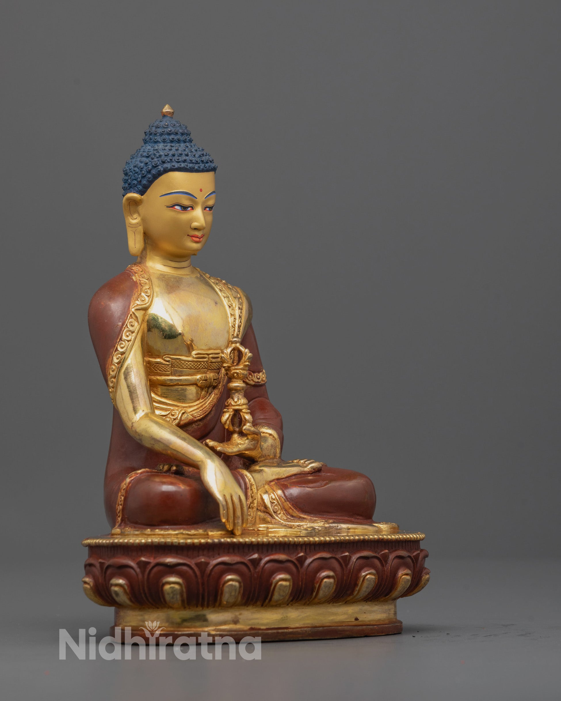 side view of Mitrugpa Sculpture showing lotus base, detailed carvings, and traditional robes