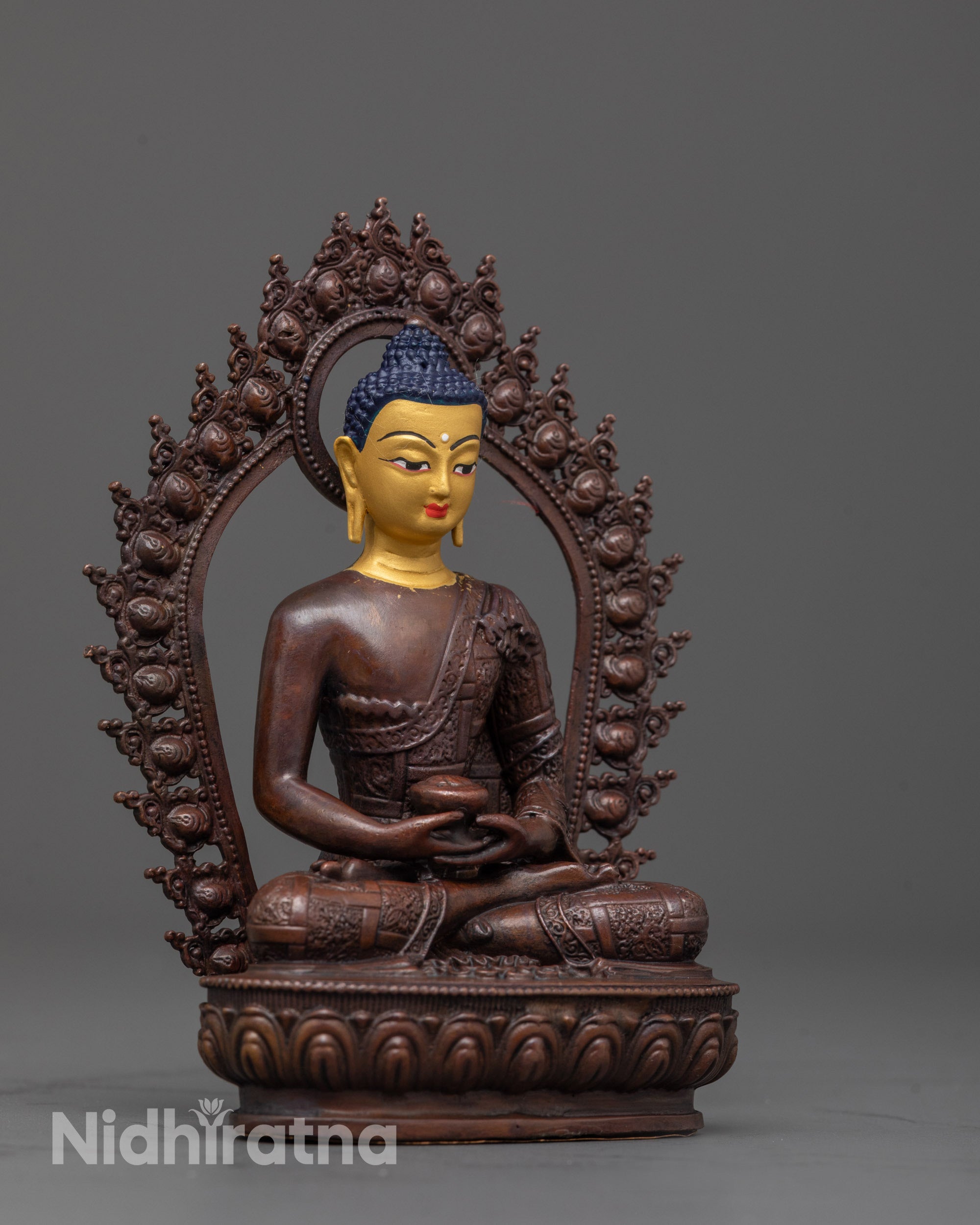side view of amitabha buddha statue showing detailed robe patterns and lotus seat
