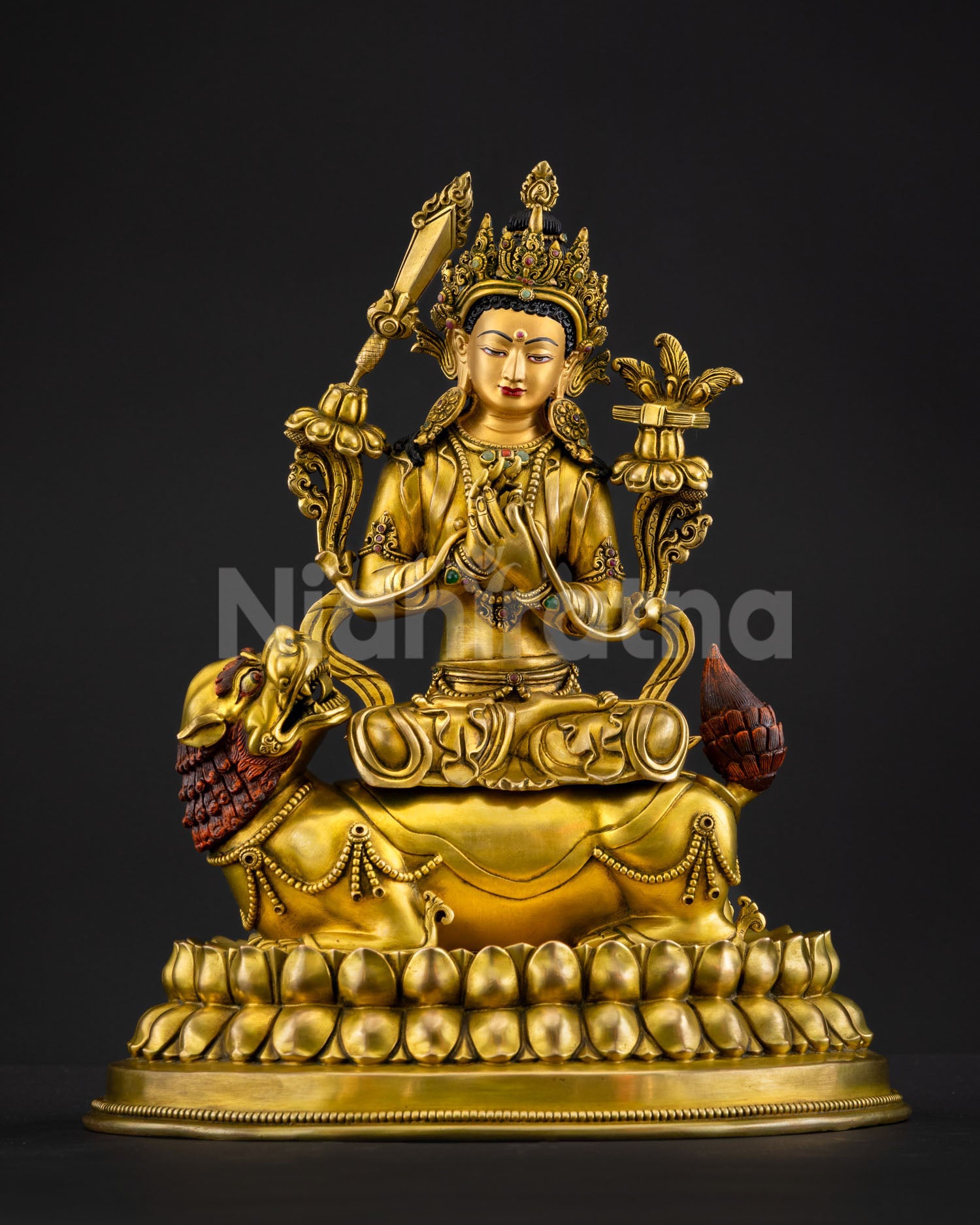 Simhanada Manjushri statue on snow lion with gold-gilded lotus pedestal