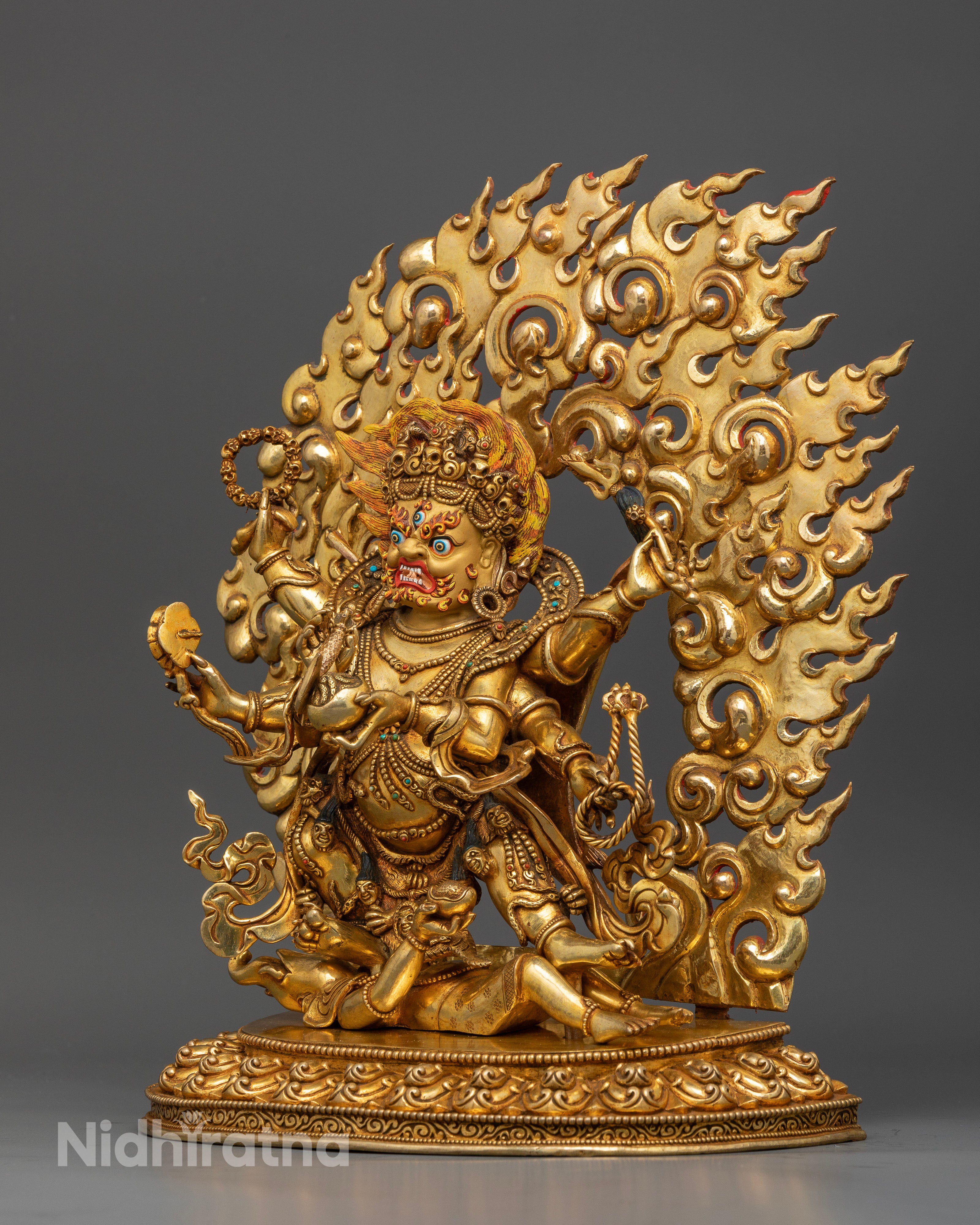 six-armed-mahakala-standing-on-subdued-figure-atop-detailed-lotus-pedestal