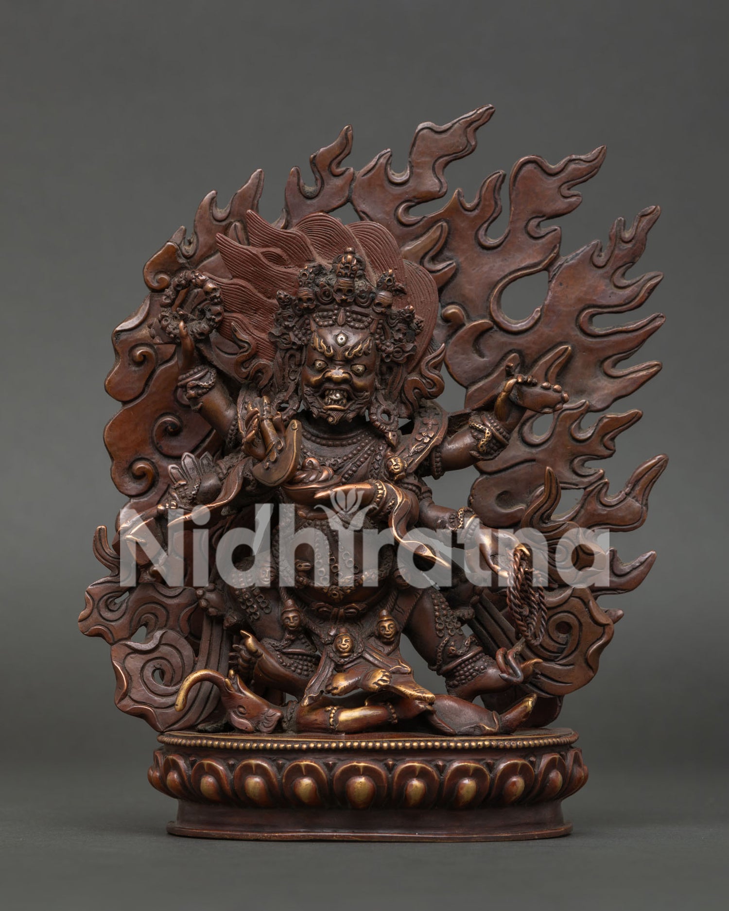 Six Armed Mahakala statue standing on human figure with lotus pedestal 3D carving.