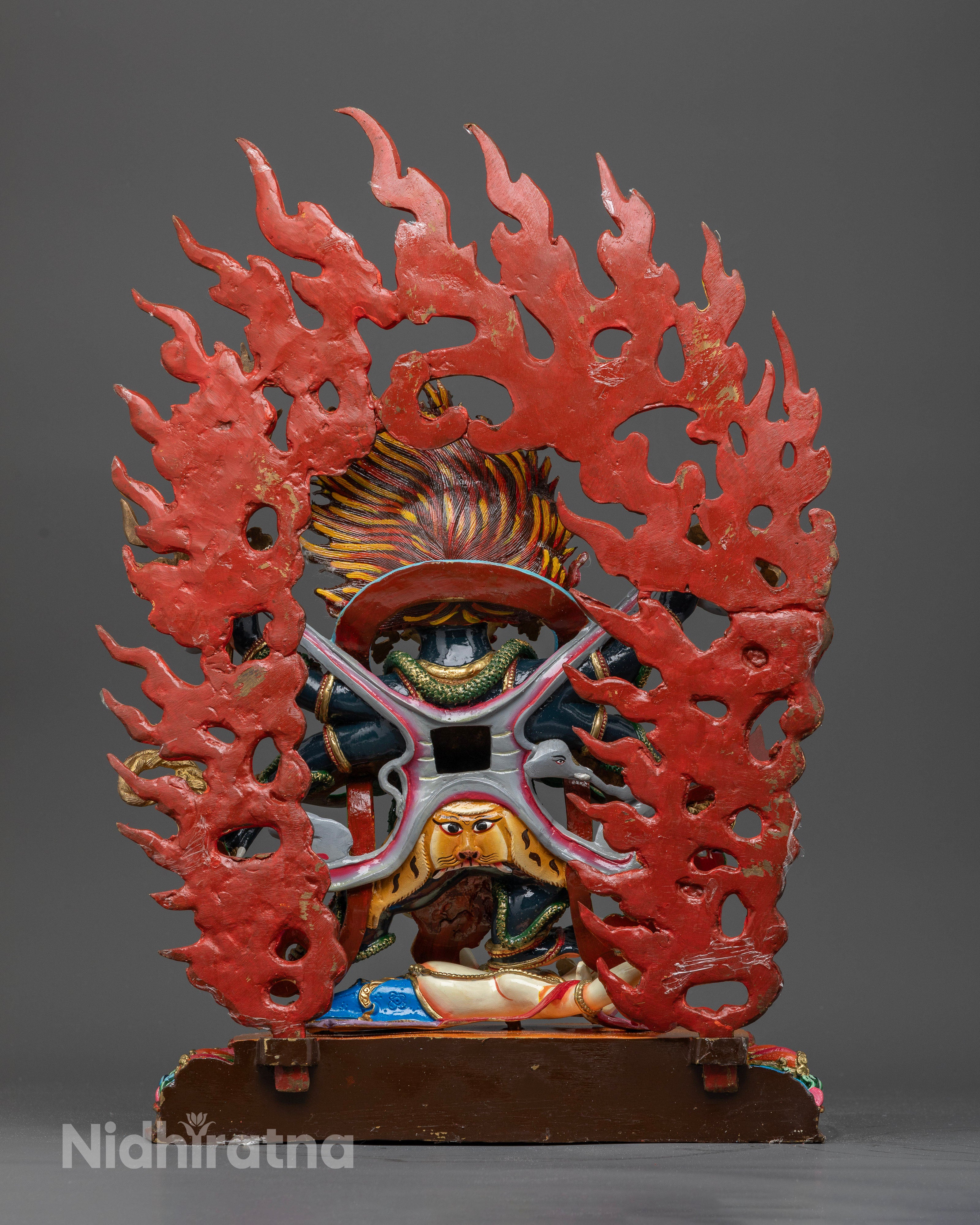 Six-Armed Mahakala Statue with Flaming Halo and Powerful Dharma Protector Symbolism.