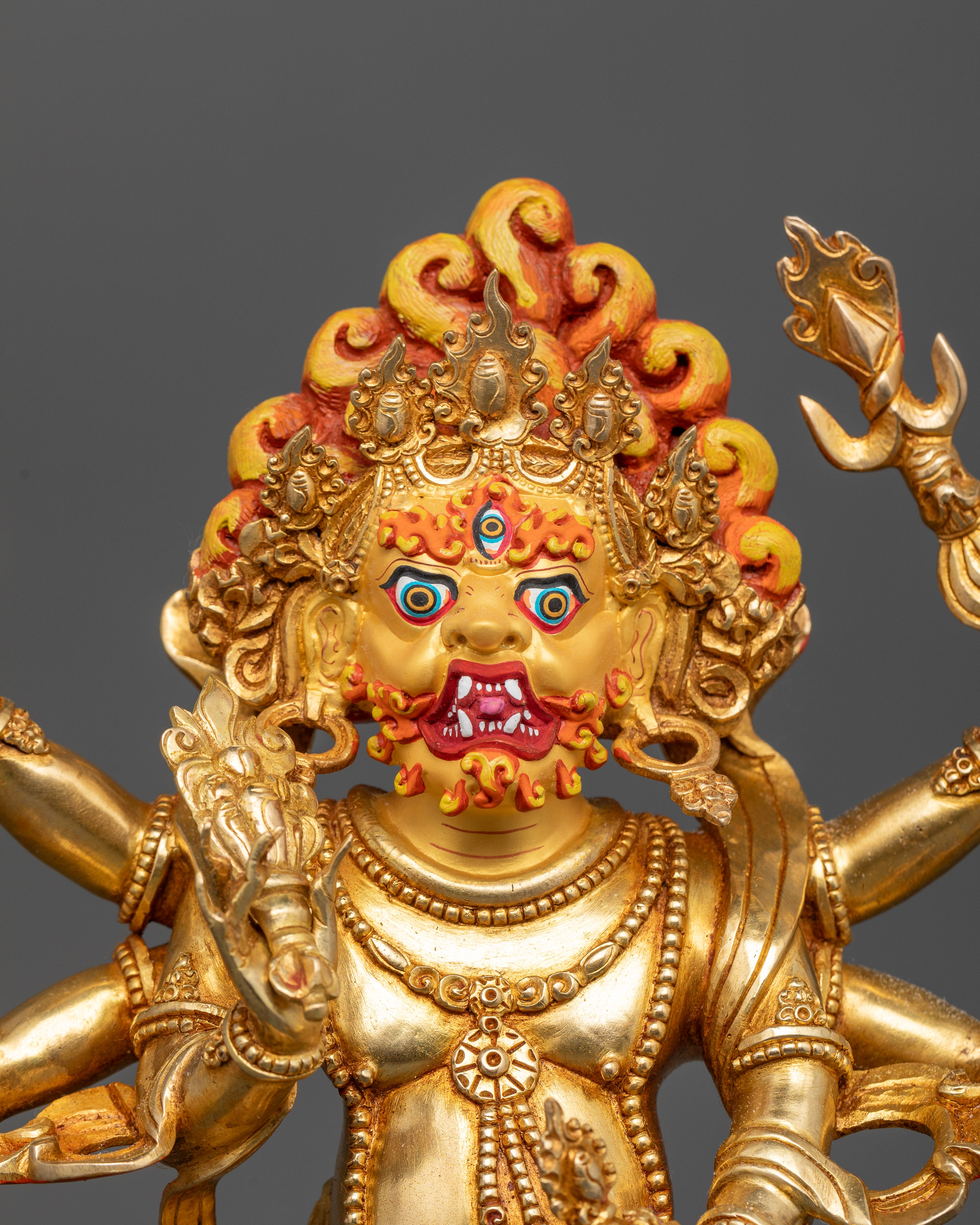 Six-Armed White Mahakala Statue Holding a Kapala and Kartika Knife.